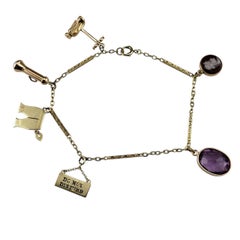 Pulsera de dijes de oro amarillo de 14 quilates con dijes surtidos #22908