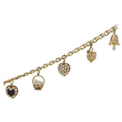 14 Karat Yellow Gold Charm Bracelet with Pearls and Ceylon Sapphires