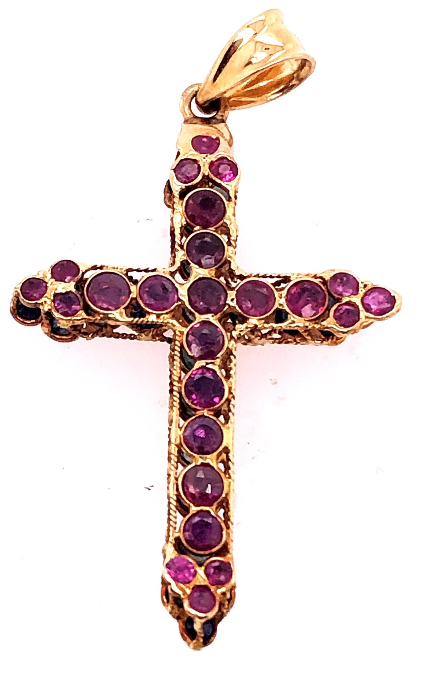 14 Karat Yellow Gold Charm Cross Pendant with Rubies and Sapphires Reversible 
24 round rubies and 24 round sapphires.
3 grams total weight.
38.14 mm height.