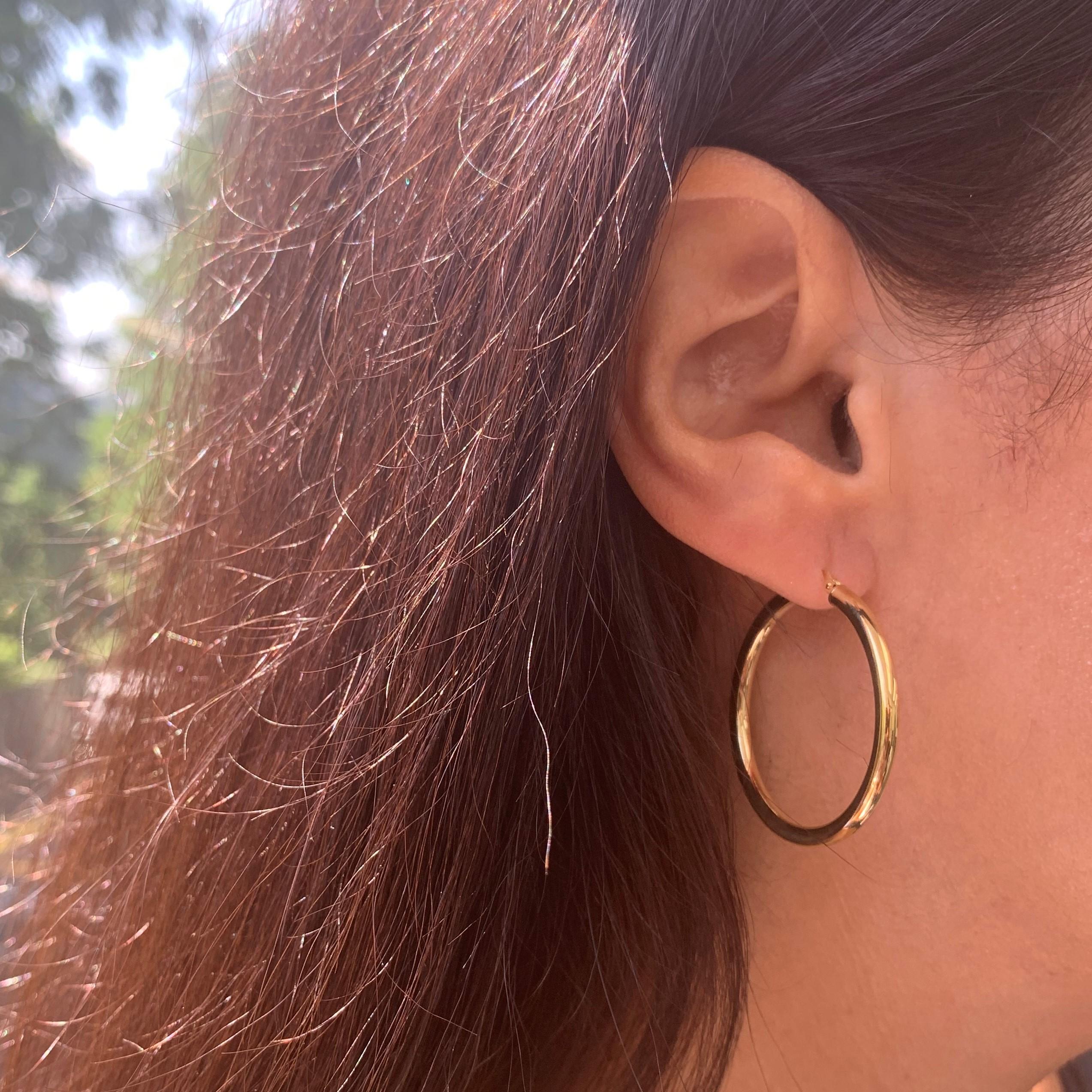 Quality Italian Design Hoops: Made and designed in Italy where craftsmen are known for their attention to design and detail, these earrings boast a chic 14k yellow gold hoop that will add a dash of glam to your everyday look. Diameter of Hoop is 1