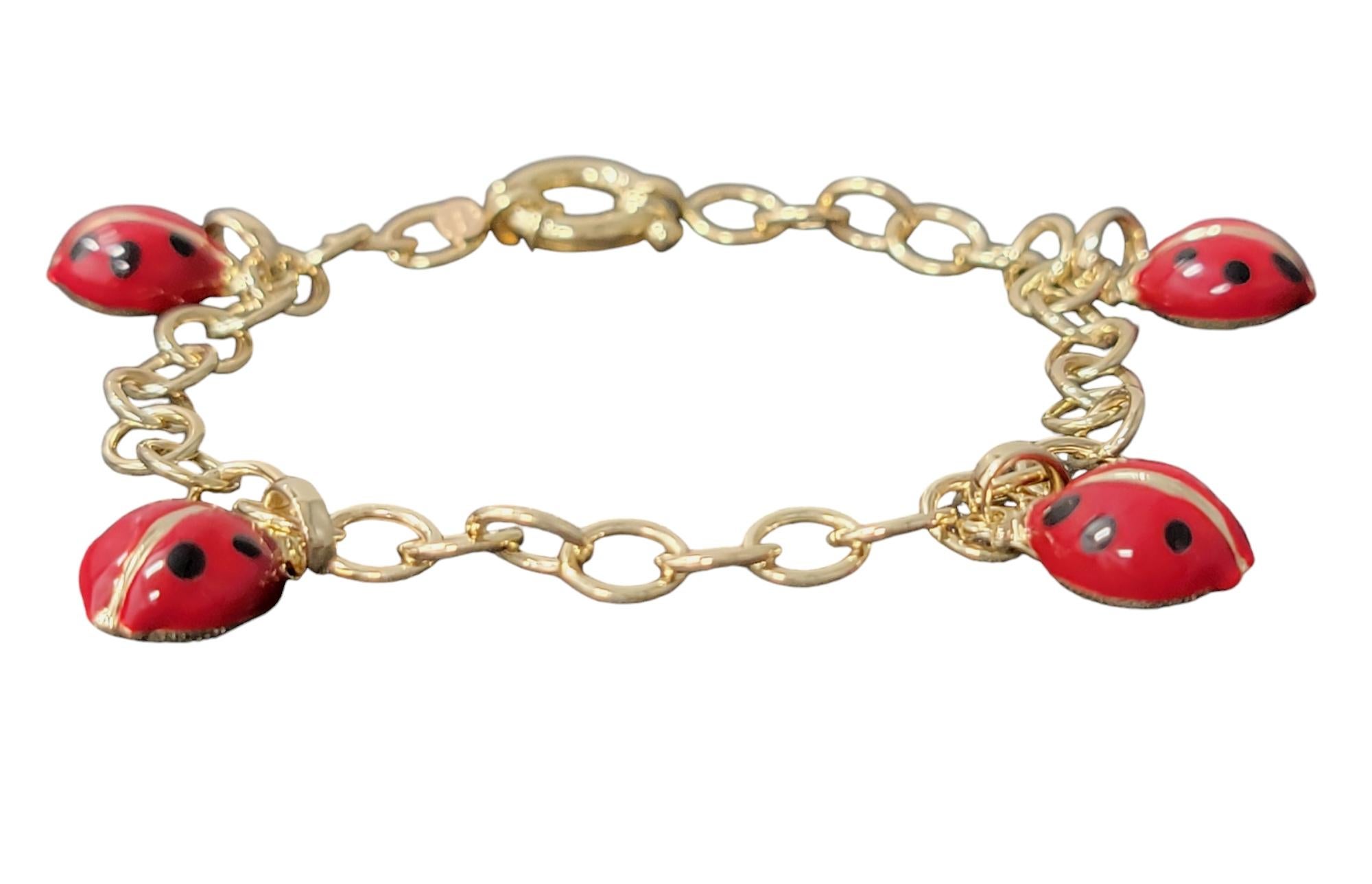 Add a playful touch of whimsy and charm to your style with this delightful ladybug charm bracelet, beautifully crafted in radiant 14 karat yellow gold. Featuring four enchanting ladybug dangle charms, each one is intricately designed with delicate