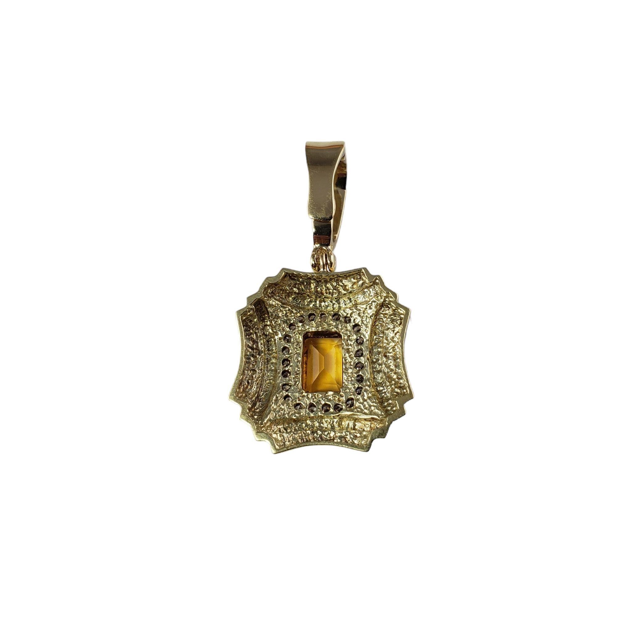 Vintage 14 Karat Yellow Gold Citrine and Diamond Pendant JAGi Certified-

This stunning pendant features one emerald cut citrine quartz and 23 round brilliant cut diamonds set in classic 14K yellow gold.

Citrine weight: .81 ct.

Total diamond