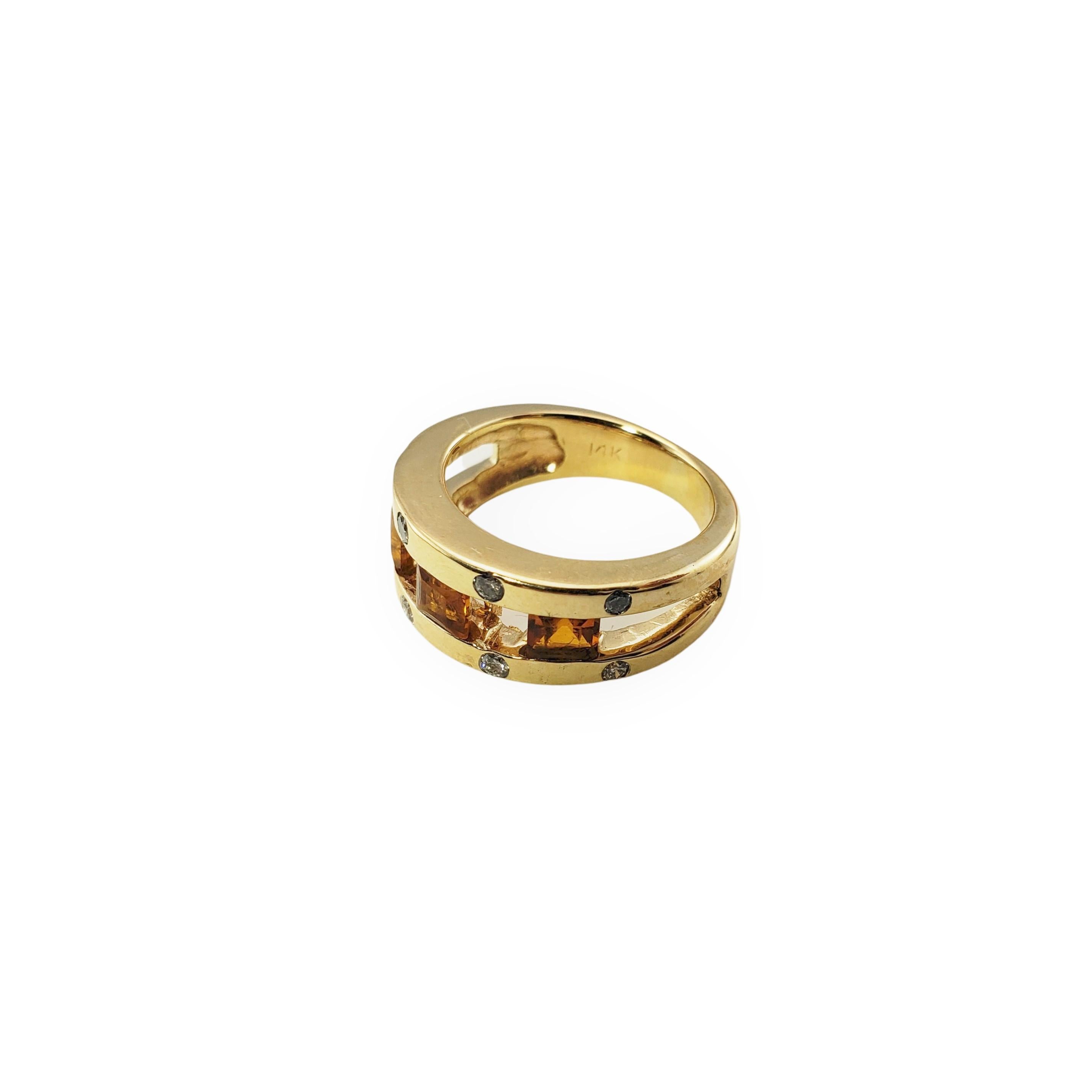 14 Karat Yellow Gold Citrine and Diamond Ring Size 5.25 GAI Certified-

This elegant band features three princess cut citrine stones and eight round brilliant cut diamonds set in classic 14K yellow gold.  Width:  7 mm.  Shank:  4 mm.

Total citrine