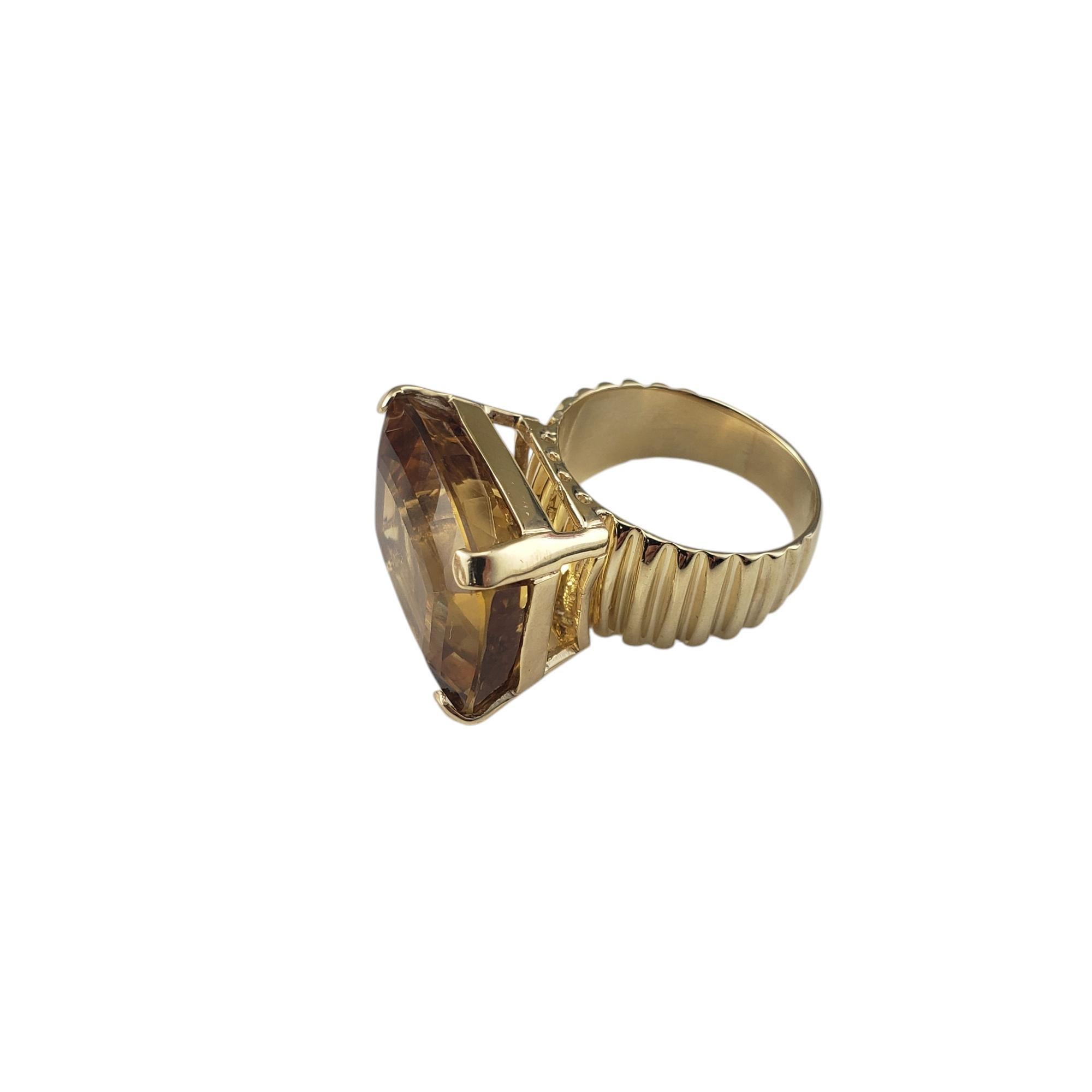 14 Karat Yellow Gold Citrine Ring Size 9 JAGi Certified-

Make a statement with this spectacular ring featuring one rectangular cushion cut citrine (21.3 mm x 16.4 mm) set in beautifully detailed 14K yellow gold.
Shank: 5.5 mm.

Approximate citrine