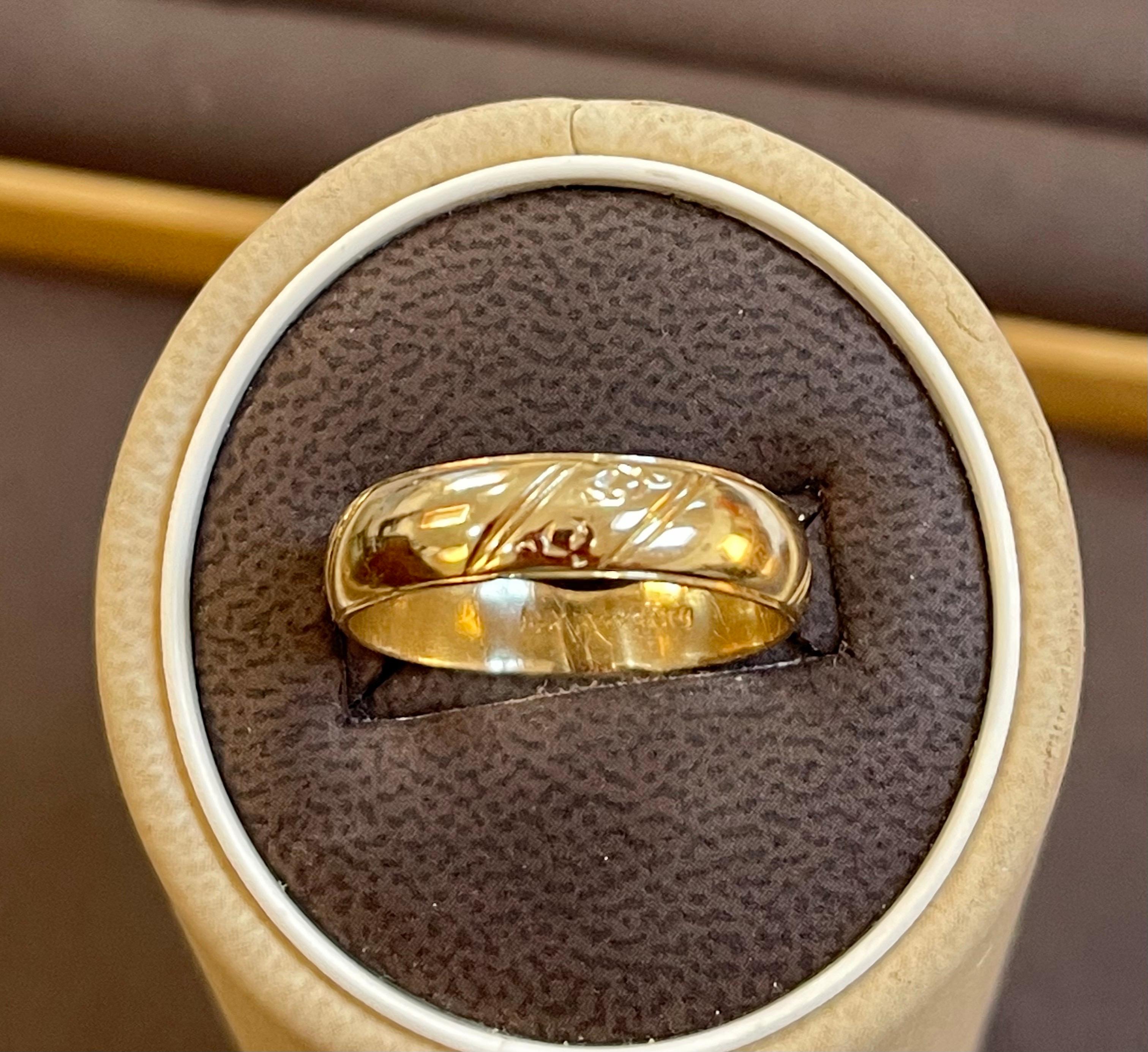 
14 Karat Yellow Gold  Classic Wide Wedding Band Ring Size 9, Unisex
This timeless style adds a Light classic Design all over  band.
Quality craftsmanship makes this long lasting band a great value. rounded inside edge for increased comfort.
High