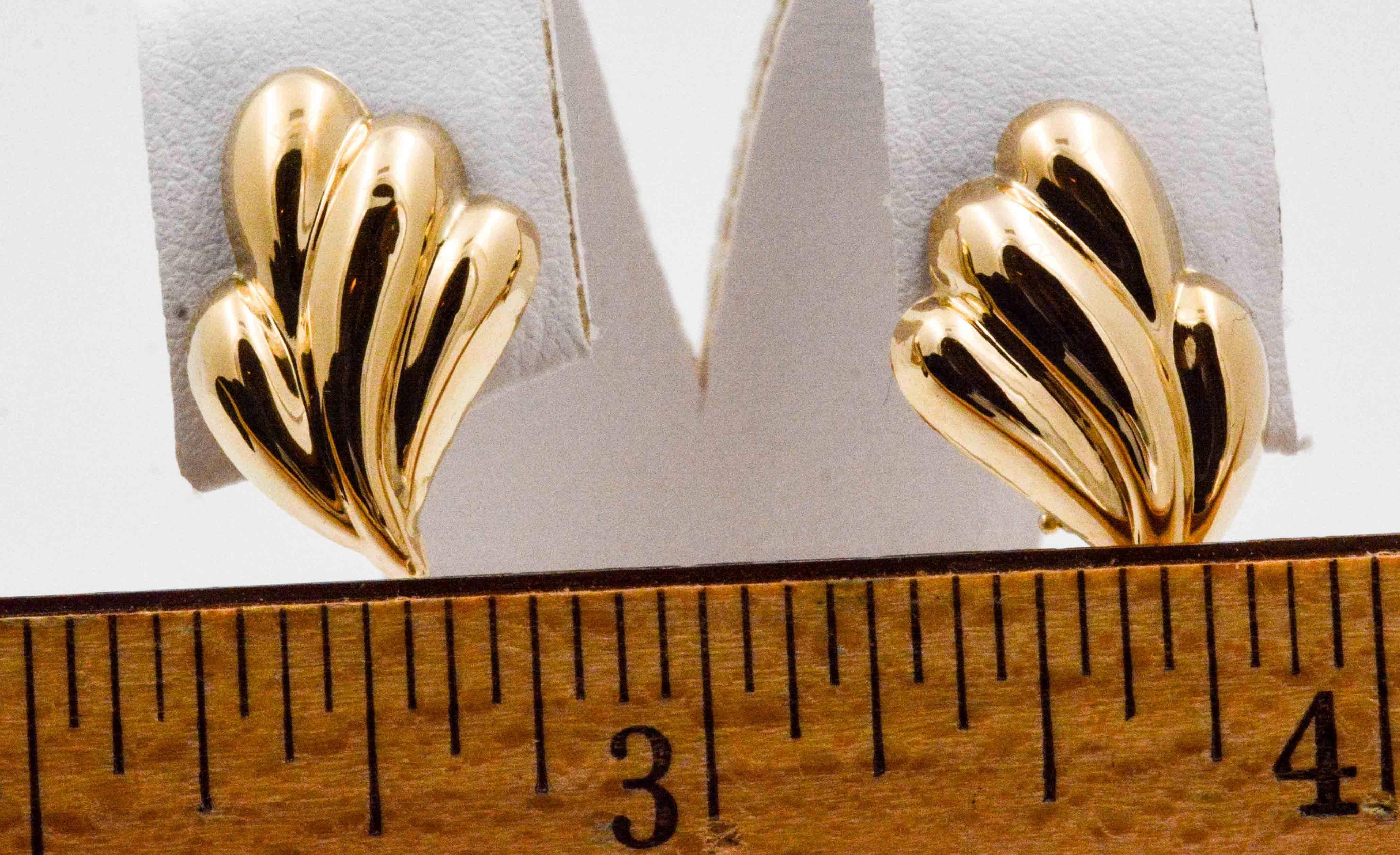 Stylish and tailored 14 karat yellow gold clip back earrings lend a sophisticated flair to your ensemble. These earrings are light as a feather and secure on the ears with a clip back, and have passed the our standard of quality.