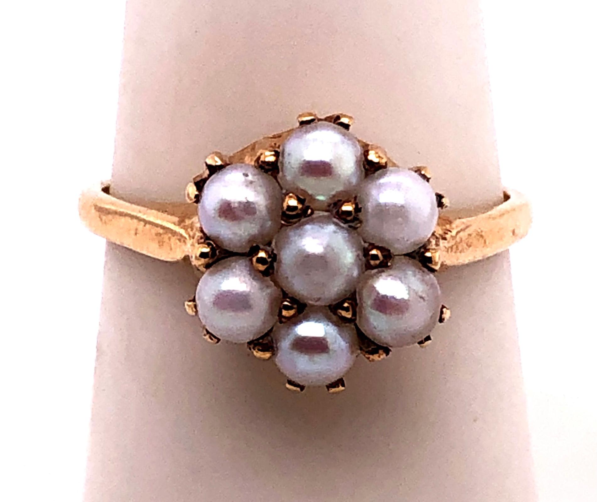 14 Karat Yellow Gold Cluster of Pearl Ring.
Size 7
2.9 grams total weight.
cluster of pearl 10 mm diameter.
Stamped 14K HAVEN on interior ring as shown. 

