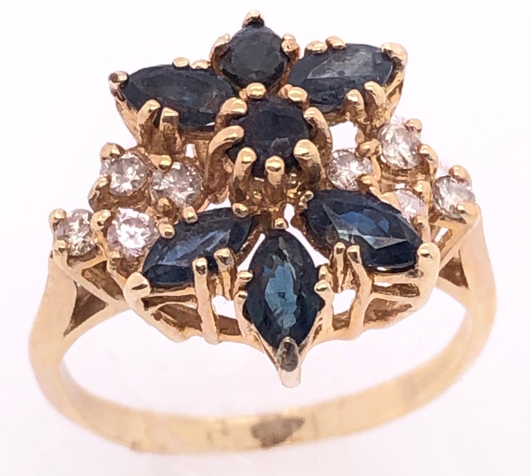 14 Karat Yellow Gold Cluster Ring with Onyx and Diamonds Size 6.
8 round diamonds
3.60 grams total weight.