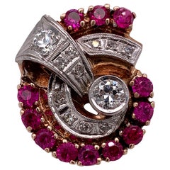 14 Karat Yellow Gold Cocktail Ring with Diamonds and Rubies in a Swirl Pattern