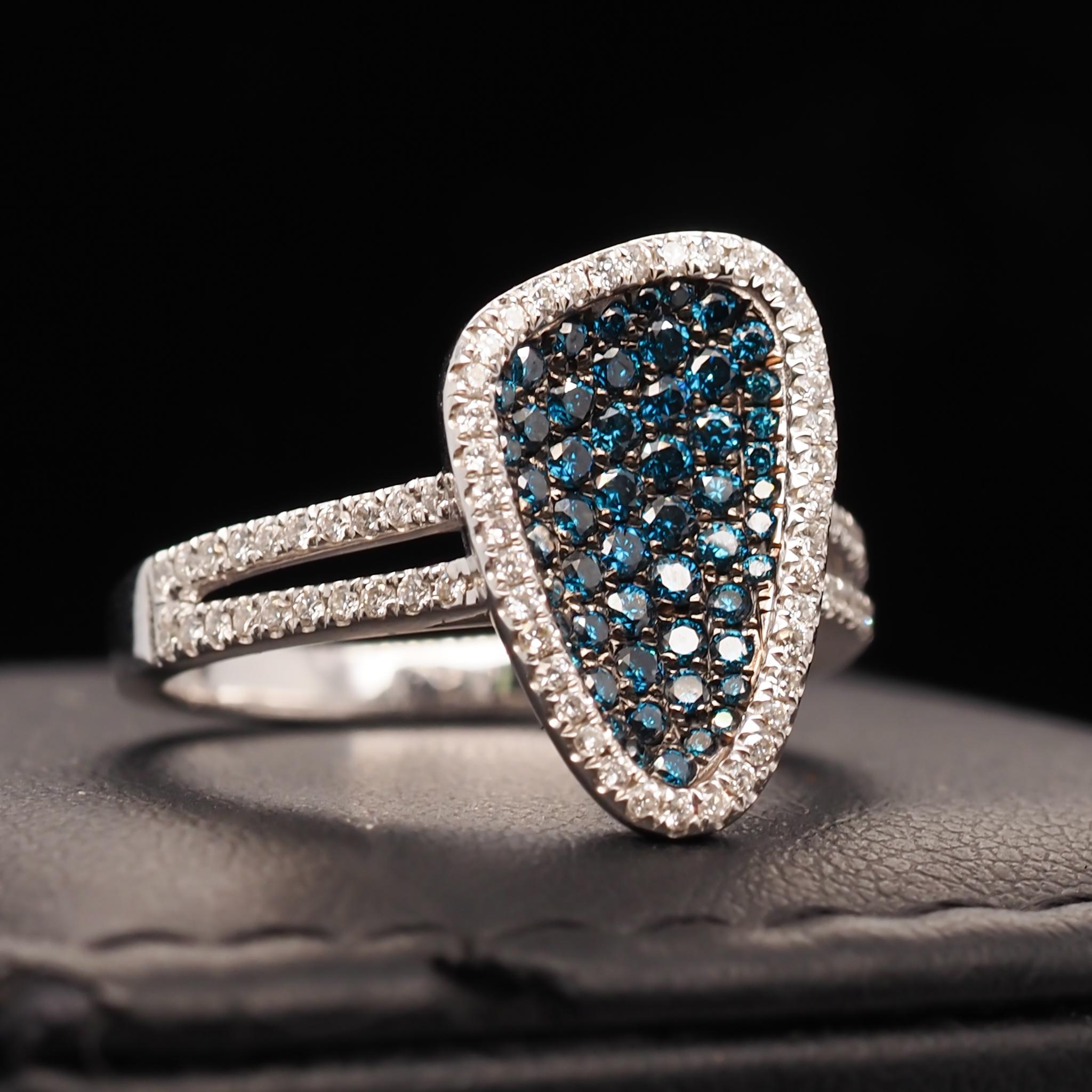 Year: 2000s

Item Details:
Ring Size: 6.75
Metal Type: 14K White Gold [Hallmarked, and Tested]
Weight: 4.6 grams

Diamond Details: 1.50ct total weight. Mixed G-H Color, Si clarity white diamonds and color treated natural blue diamonds.

Band Width: