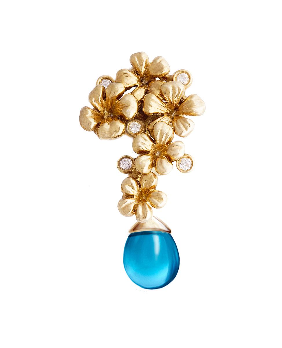 The Plum Blossom drop pendant necklace is made of 14 karat yellow gold. It is encrusted with 5 round diamonds and a removable drop of natural topaz that can be detached. This collection was designed by Berlin-based oil painter Polya Medvedeva and