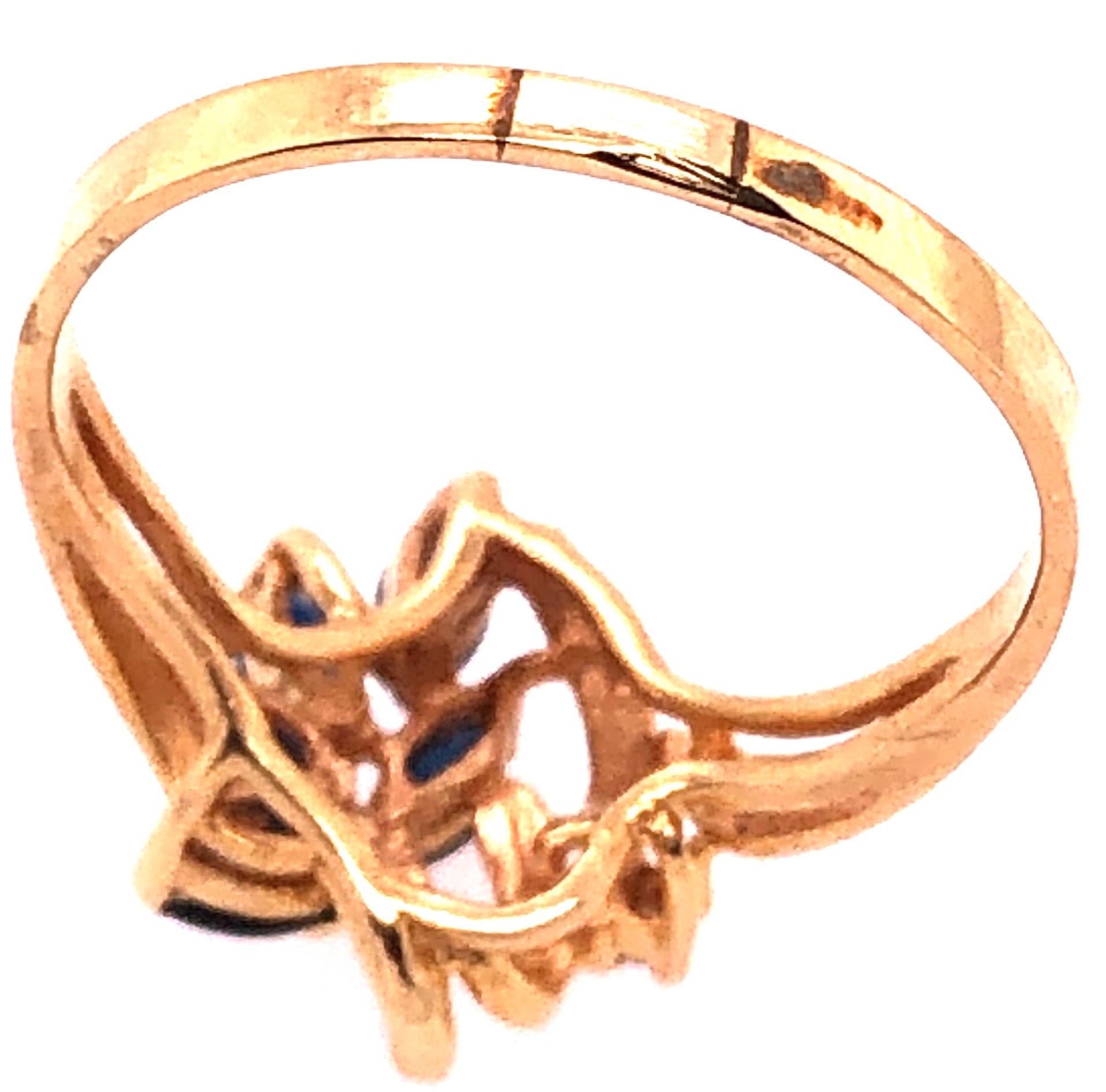 Marquise Cut 14 Karat Yellow Gold Contemporary Ring with Sapphire and Diamond Accents For Sale