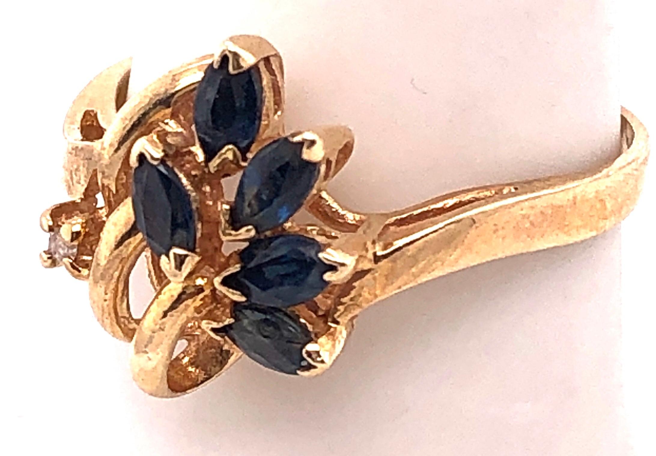 14 Karat Yellow Gold Contemporary Ring with Sapphire and Diamond Accents For Sale 1