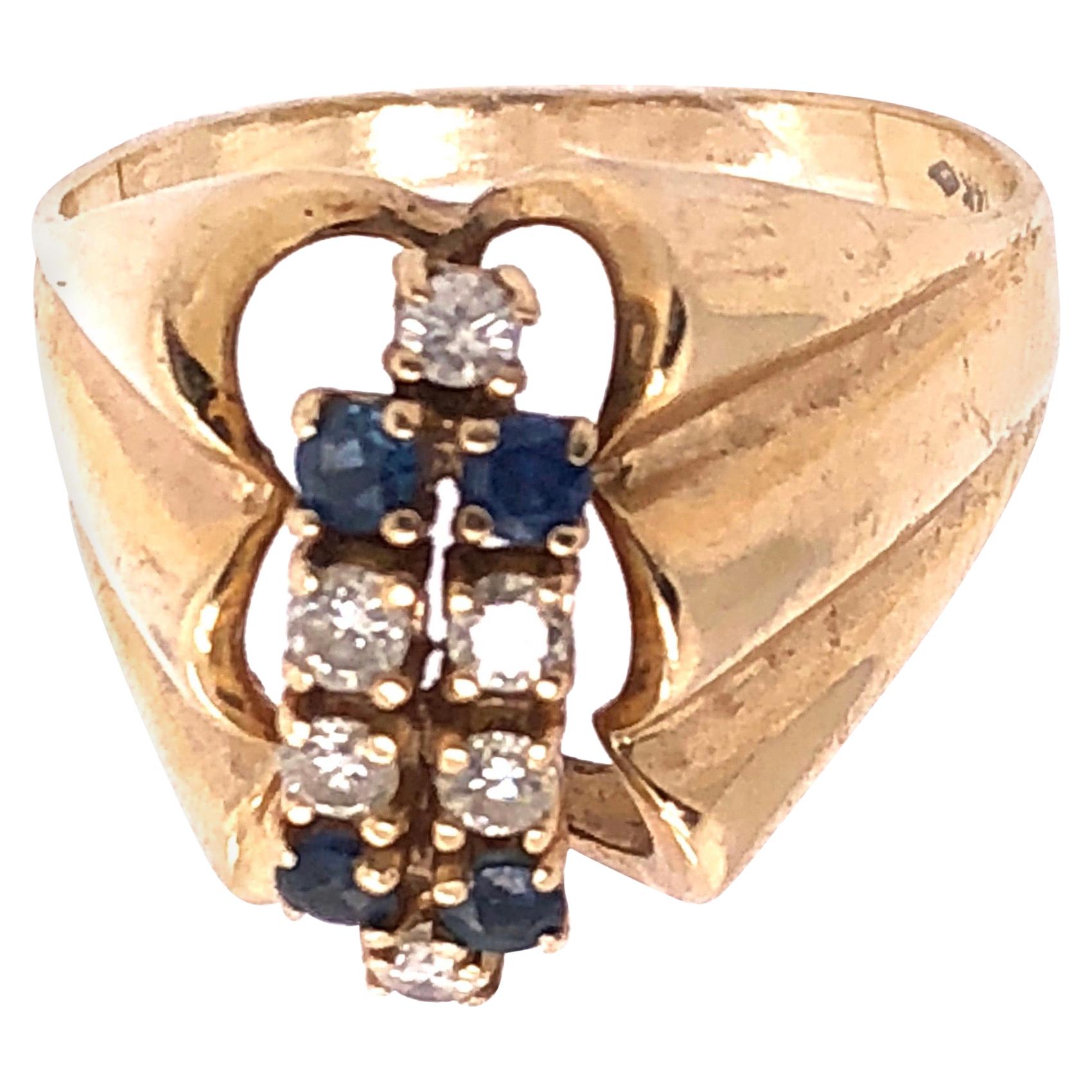 14 Karat Yellow Gold Contemporary Ring with Sapphire and Diamonds