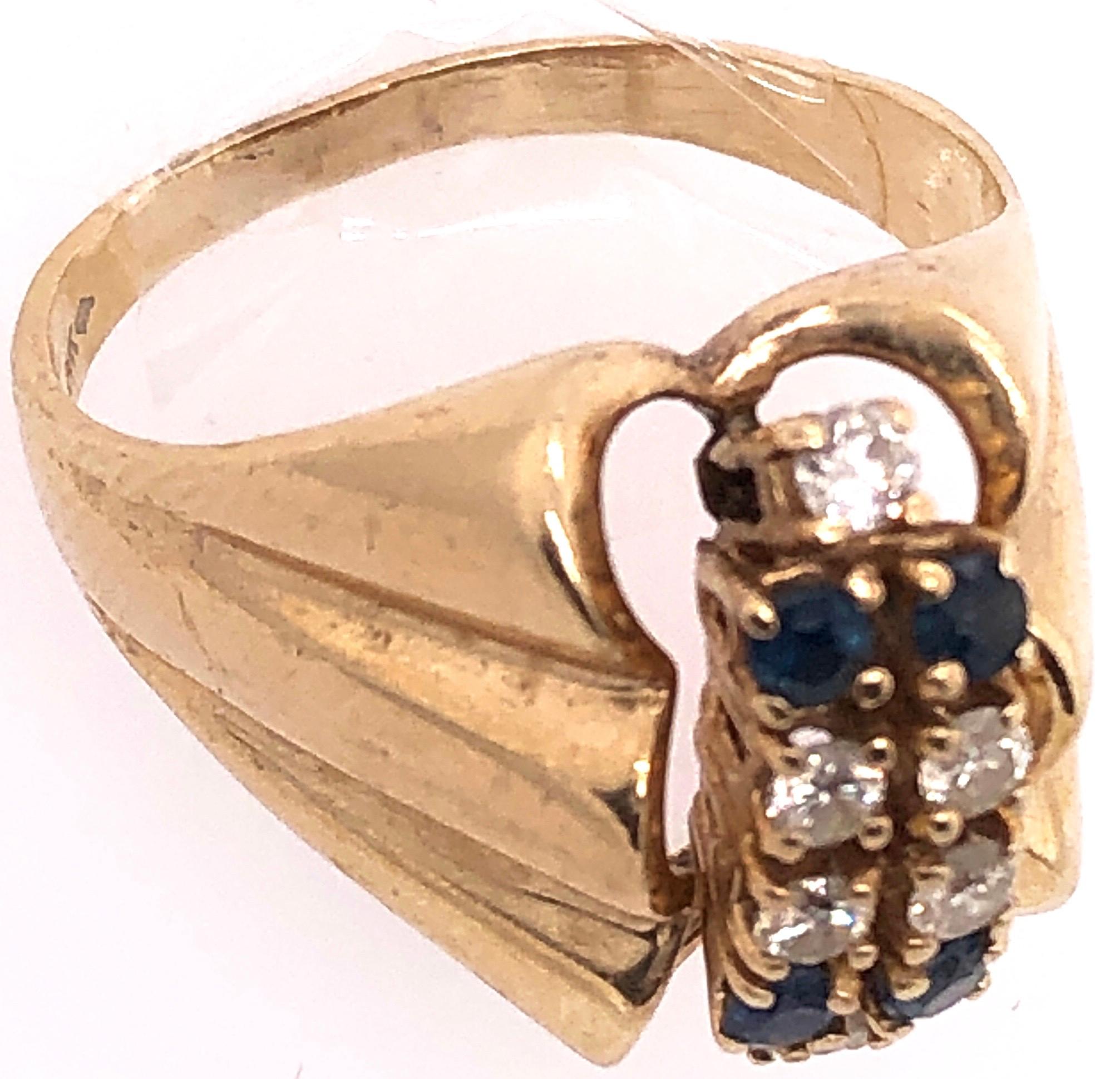 14 Karat Yellow Gold Contemporary Ring with Sapphire and Diamonds In Good Condition For Sale In Stamford, CT