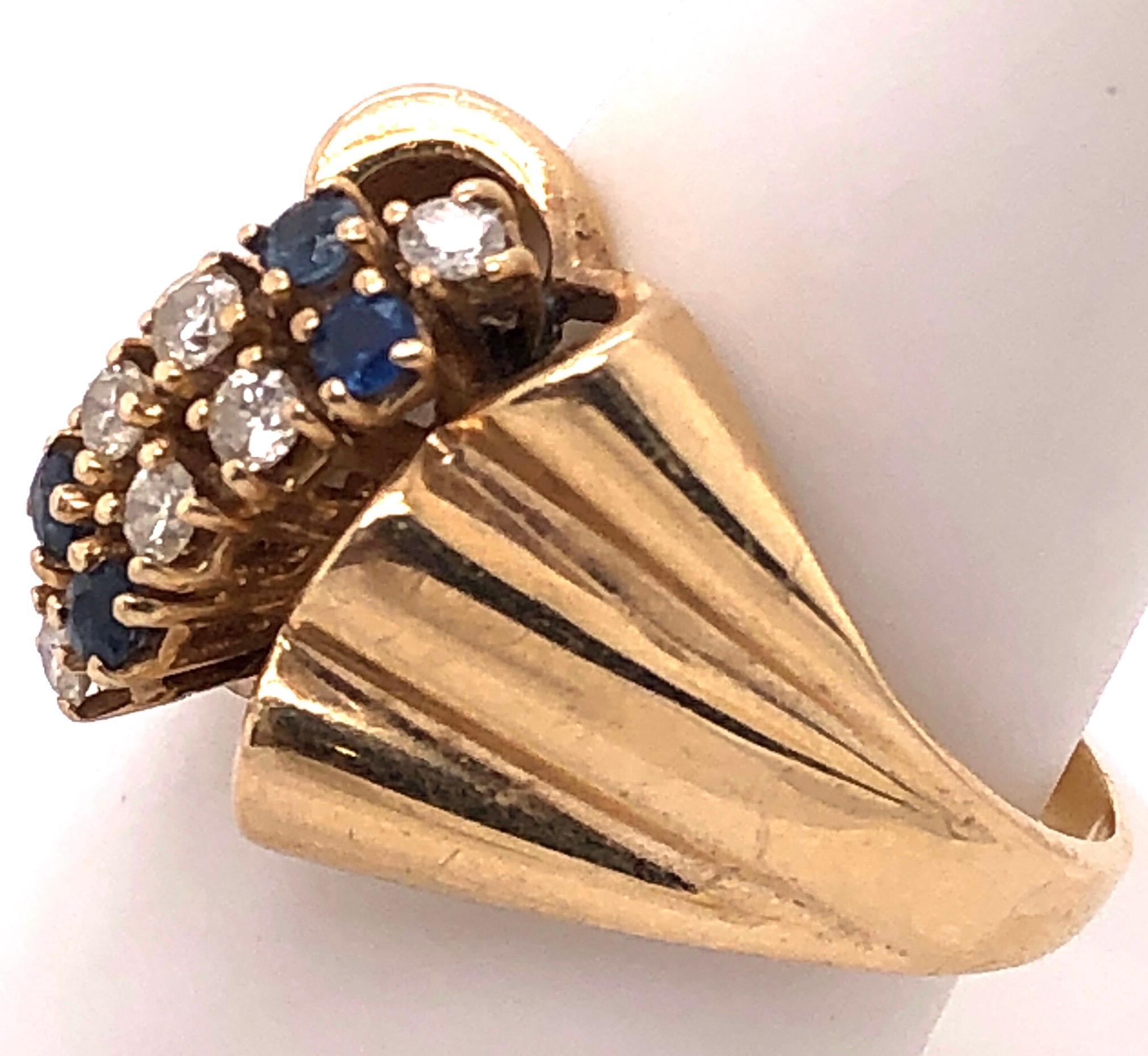 Women's or Men's 14 Karat Yellow Gold Contemporary Ring with Sapphire and Diamonds For Sale