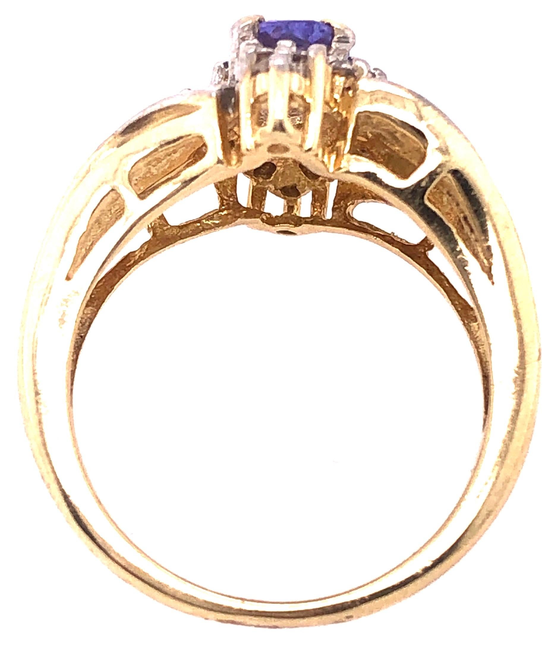 14 Karat Yellow Gold Contemporary Ring with Topaz and Diamonds.
Size 6
6 grams total weight.