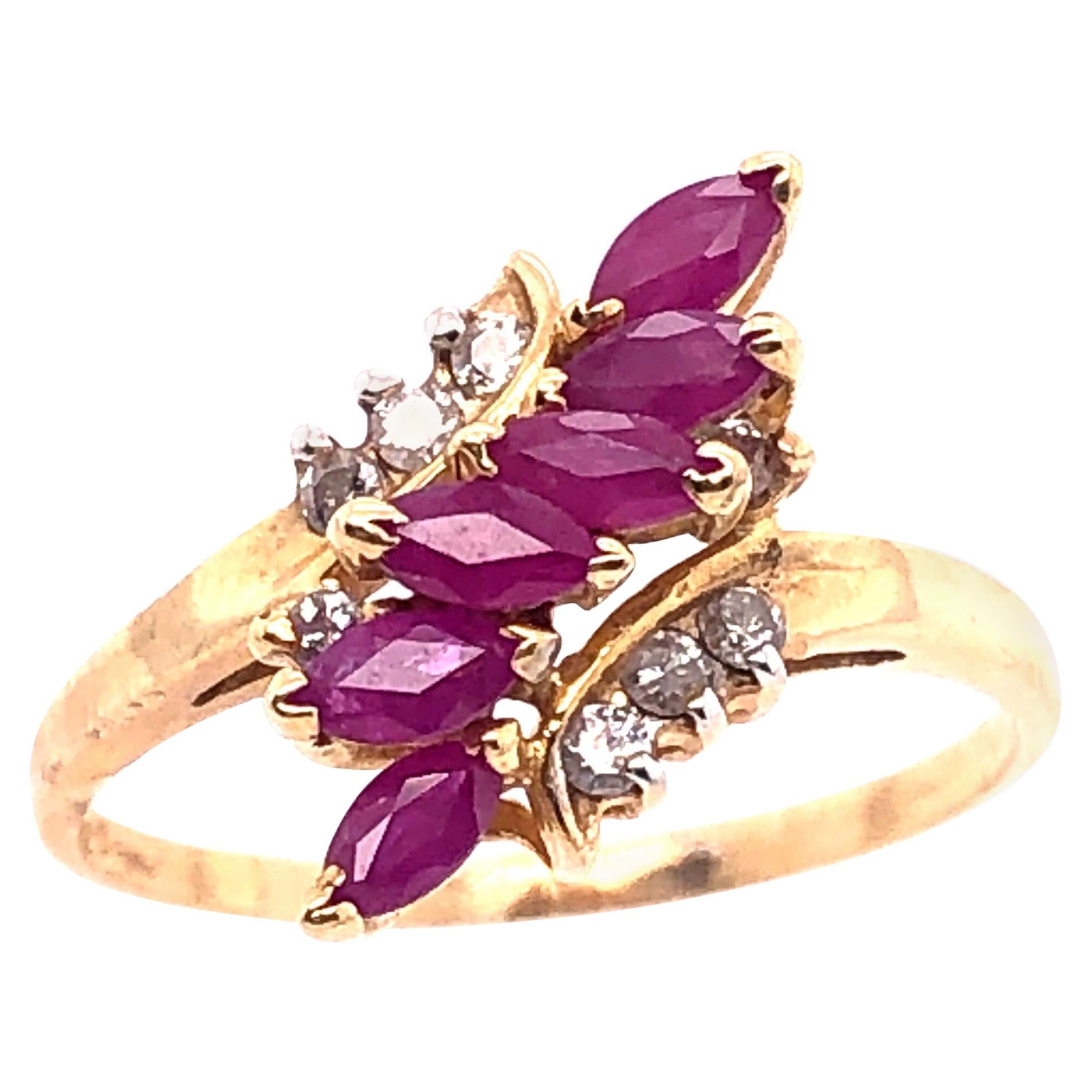 14 Karat Yellow Gold Contemporary Ruby Ring with Diamond Accents For Sale