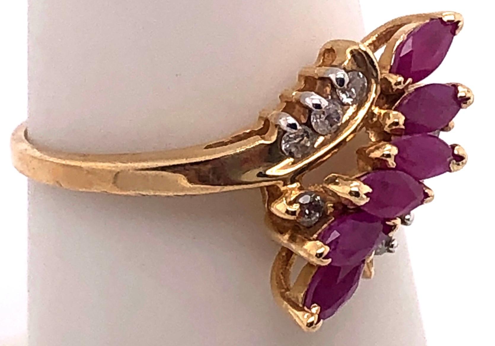 14 Karat Yellow Gold Contemporary Ruby Ring With Diamond Accents Size 6.75
0.05 Total diamond weight.
Size 6.75
3.23 grams total weight.