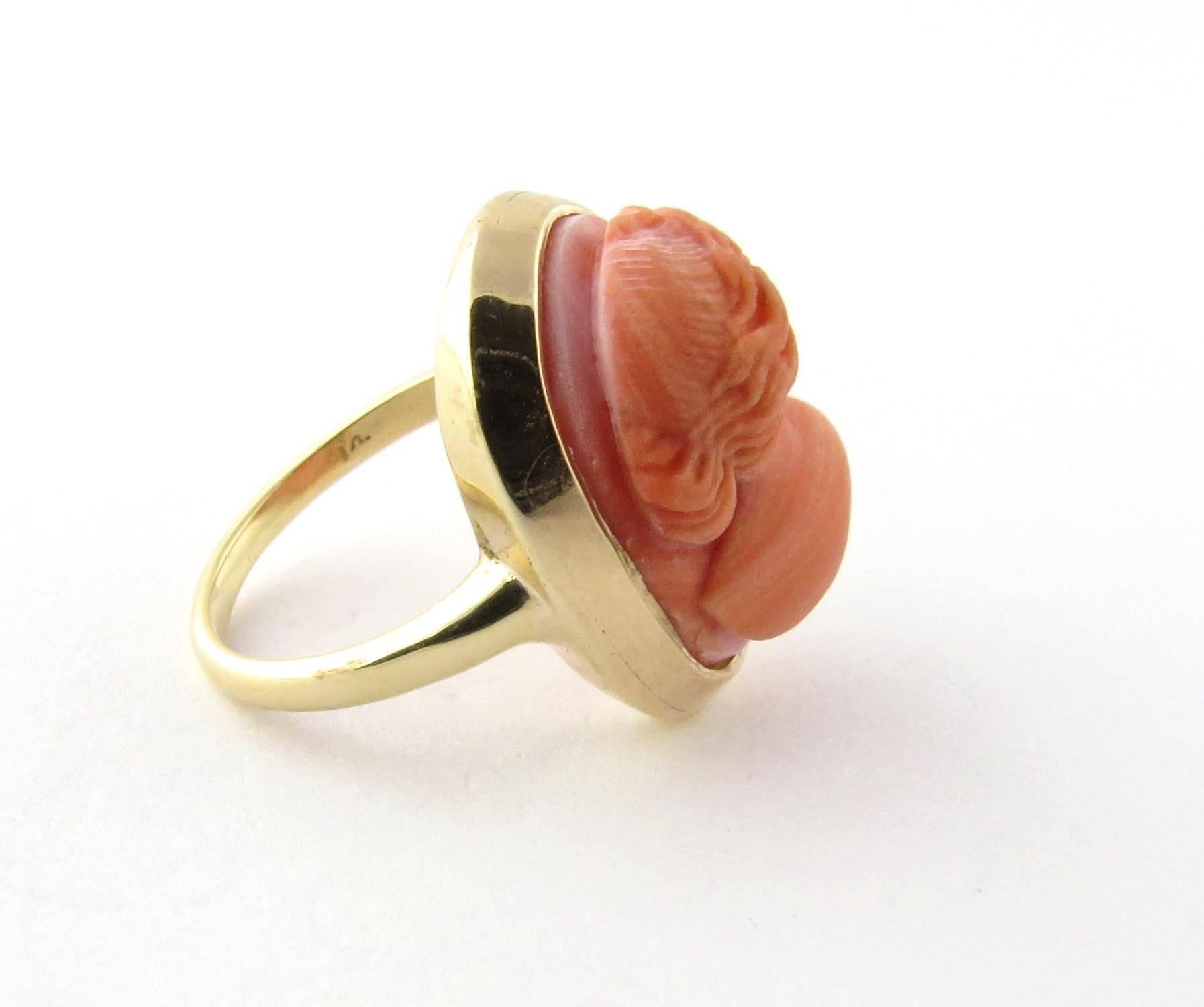 Vintage 14K Yellow Gold Coral Cameo Ring Size 3.25 

12 x 16mm oval coral is bezel set. Slight chip on right which is not noticeable to the naked eye. 

Front of ring is 19mm x 14 mm 

Back of band is 1.5 mm 

Hallmarked 14 

Masterfully designed