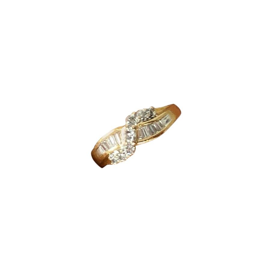14 Karat Yellow Gold Cross Over Baguette and Round Diamond Ring