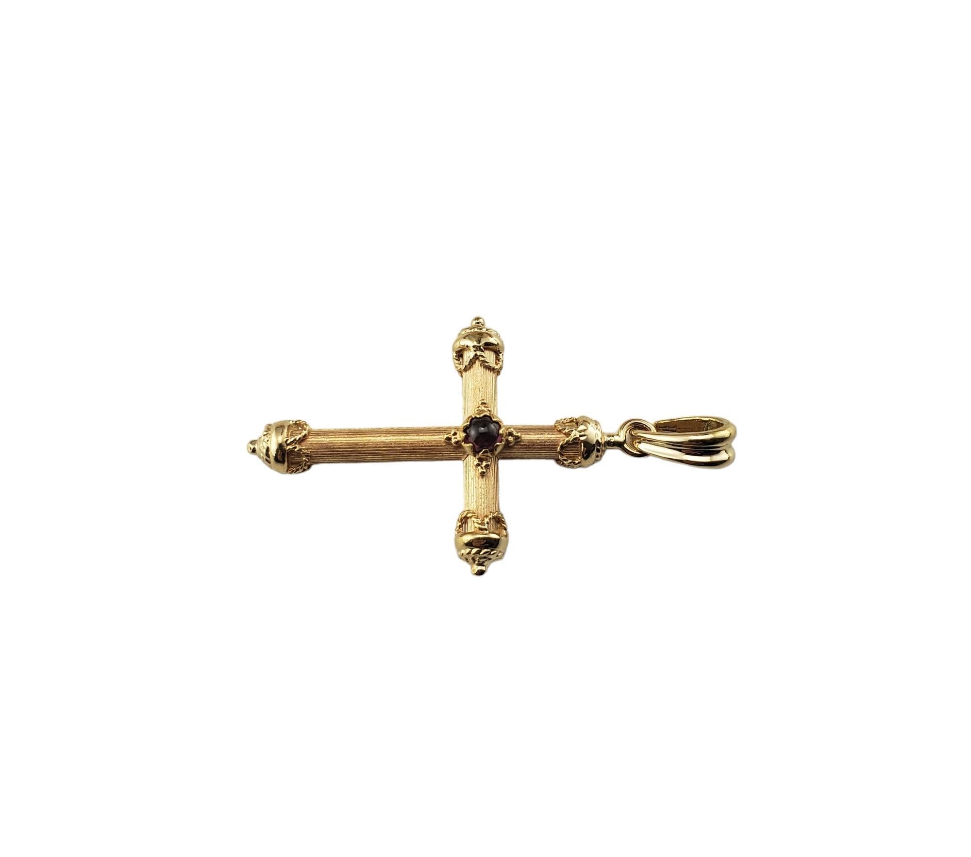 Vintage 14 Karat Yellow Gold Cross Pendant-

This lovely cross pendant is crafted in beautifully detailed 14K yellow gold.  Accented with one round cabochon purple stone.

Size:  34.6 mm x 22.7 mm

Stamped: 585

Weight: 3.2 gr./ 2.0 dwt.

*Chain not