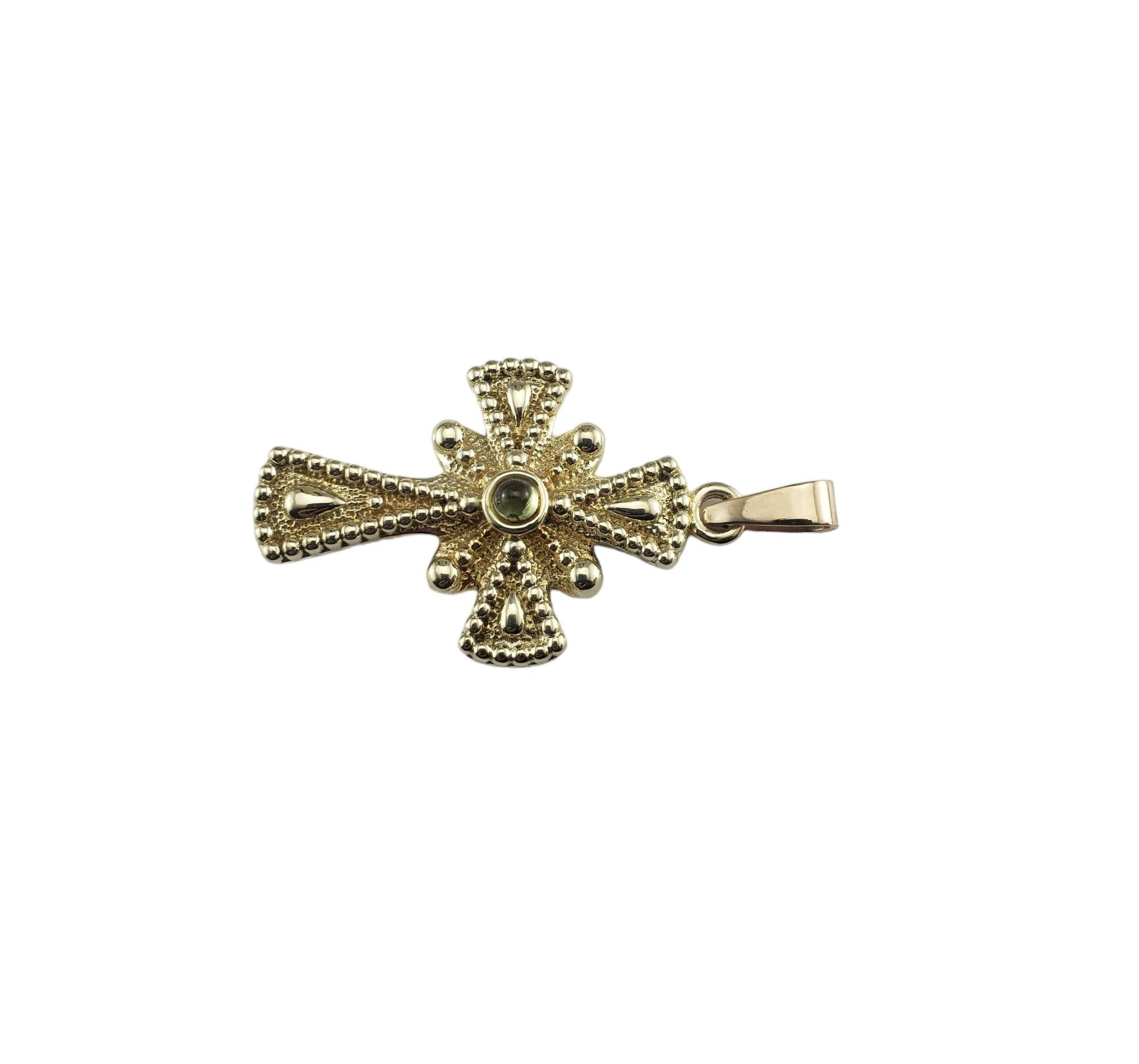 Vintage 14K Yellow Gold Cross Pendant-

This elegant cross pendant features one pale green cabochon stone set in beautifully detailed 14K yellow gold.

Size: 38 mm x 25 mm

Stamped: 14K CHINA

Weight: 3.0 gr./ 1.9 dwt.

*Chain not included.

Very