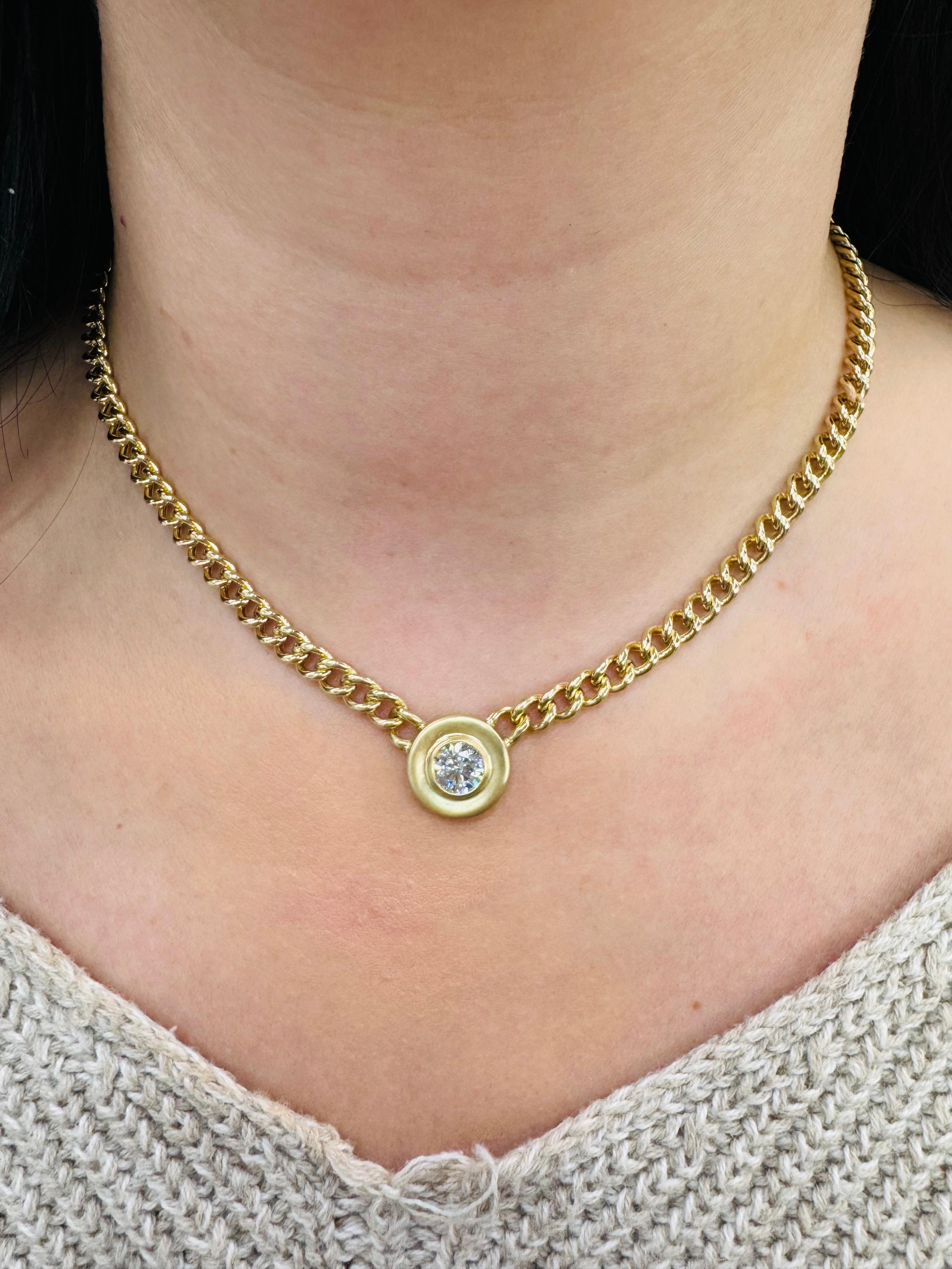 14 karat yellow gold Cuban link chain necklace featuring a round brilliant weighing 1.11 carats on a matte finished pendant.
Color J-K
Clarity SI1
Nice brilliants & life!