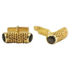 14 Karat Yellow Gold Cufflinks Beautifully Accented with 4 Black Star Sapphires