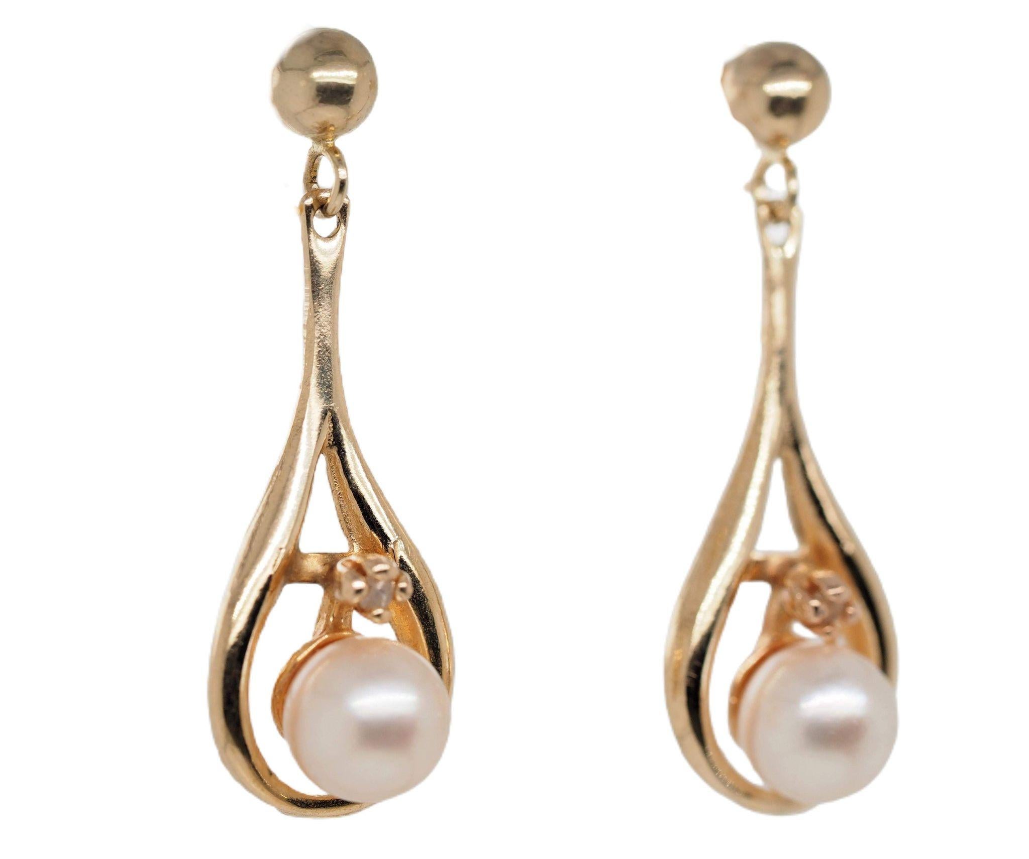 14 Karat Yellow Gold Cultured Akoya Pearl  Earrings measuring 5.5 mm. The perfect accessory to complete your classic and stylish look.  Akoya pearls are renowned for their incredible luster and are considered the classic pearl.  Completed by a post