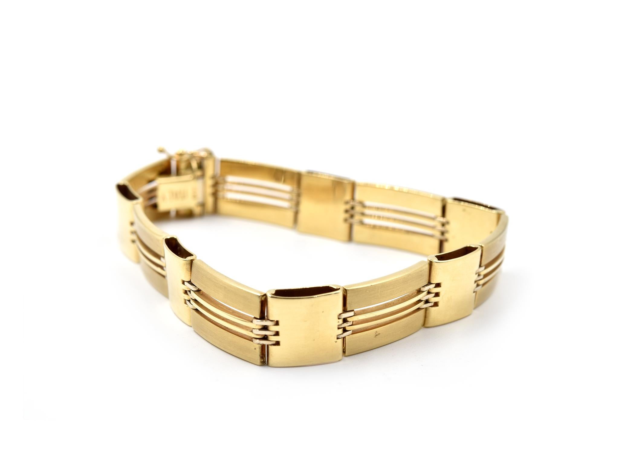 Designer: custom design
Material: 14k yellow gold
Dimensions: bracelet is 8-inch long and 1/2-inch wide
Weight: 30.89 grams
