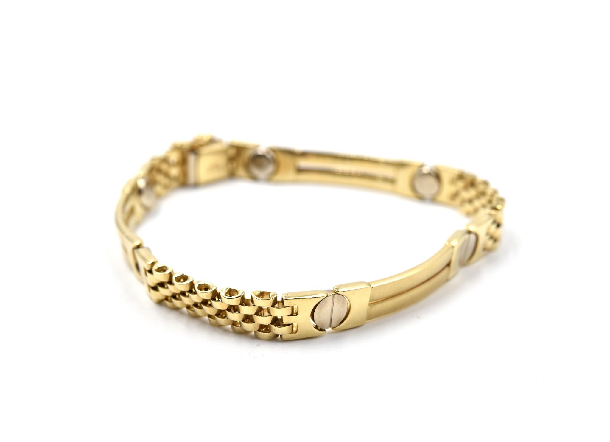 Designer: custom design
Material: 14k yellow gold
Dimensions: bracelet is 8-inch long and 1/4-inch wide
Weight: 19.7 grams
