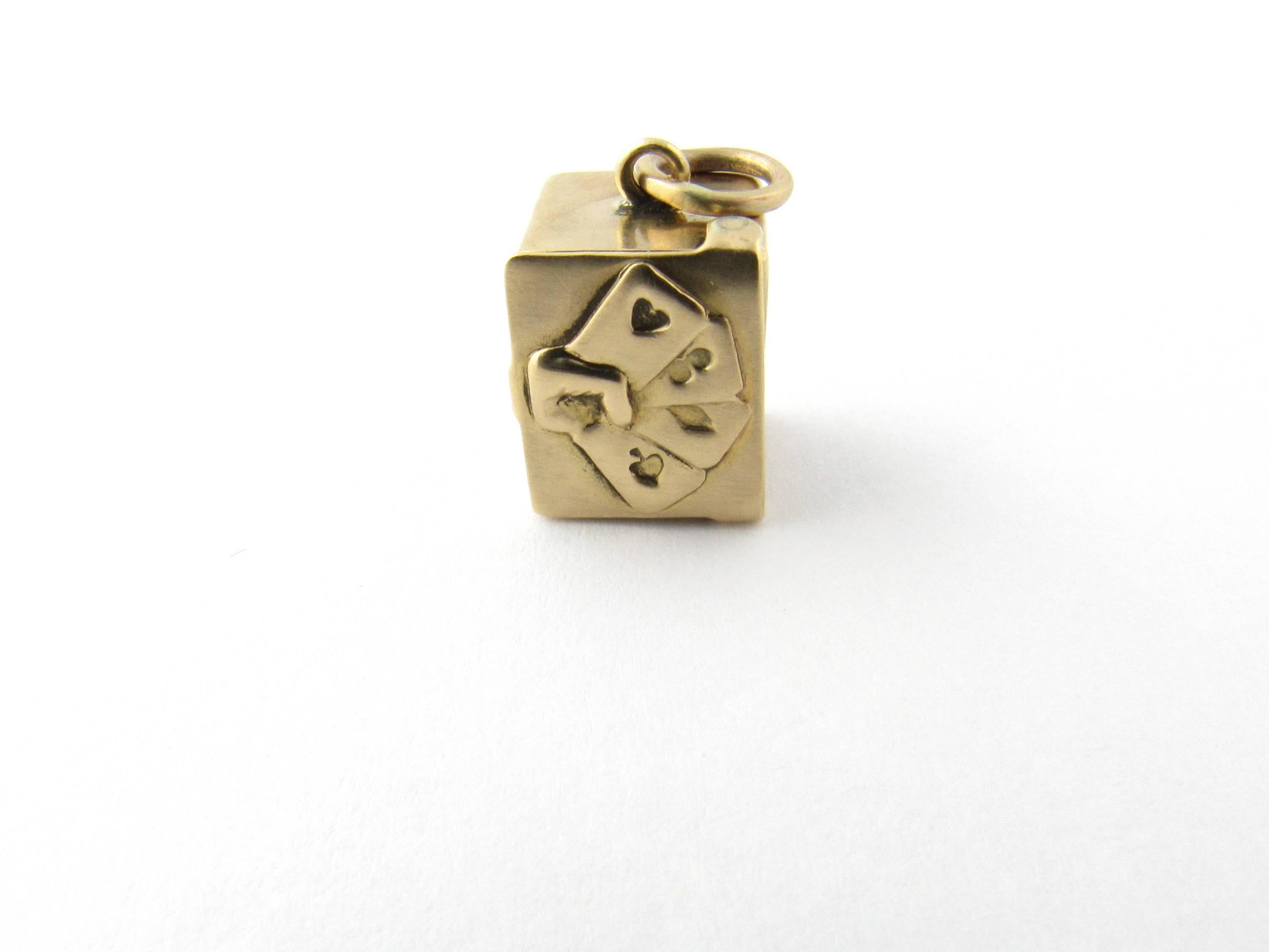 Vintage 14 Karat Yellow Gold Deck of Cards Charm
Perfect gift for the card player! 
This 3D charm features a miniature deck of playing cards in 14K gold case adorned with a hand holding four cards. Two visible cards show some fading. 
Size:  12 mm