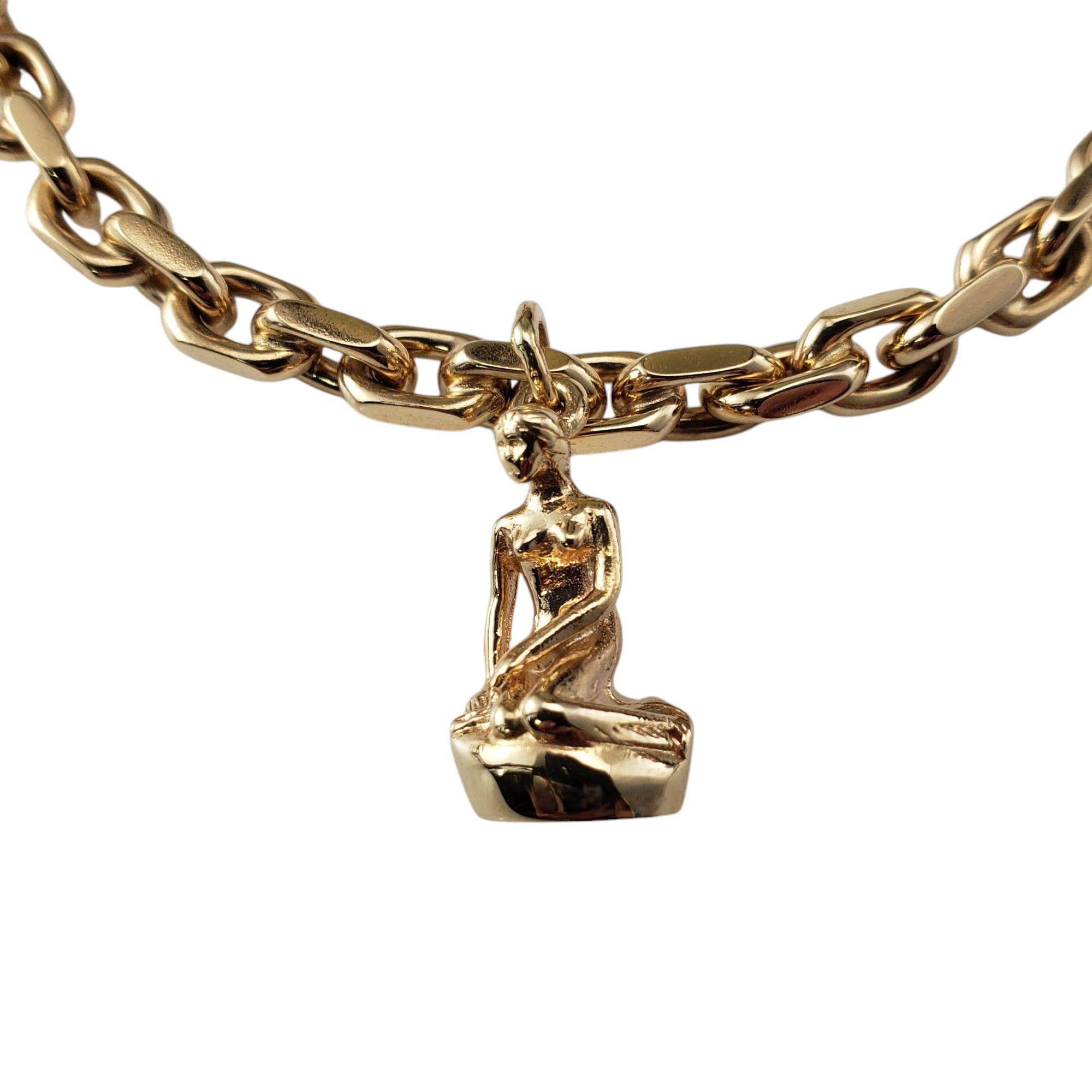 14K Yellow Gold Denmark Little Mermaid Charm Link Bracelet-

This 14K yellow gold charm pays homage to the iconic Little Mermaid statue in Copenhagen, capturing the timeless elegance of Hans Christian Andersen's beloved fairy tale. This lovely piece