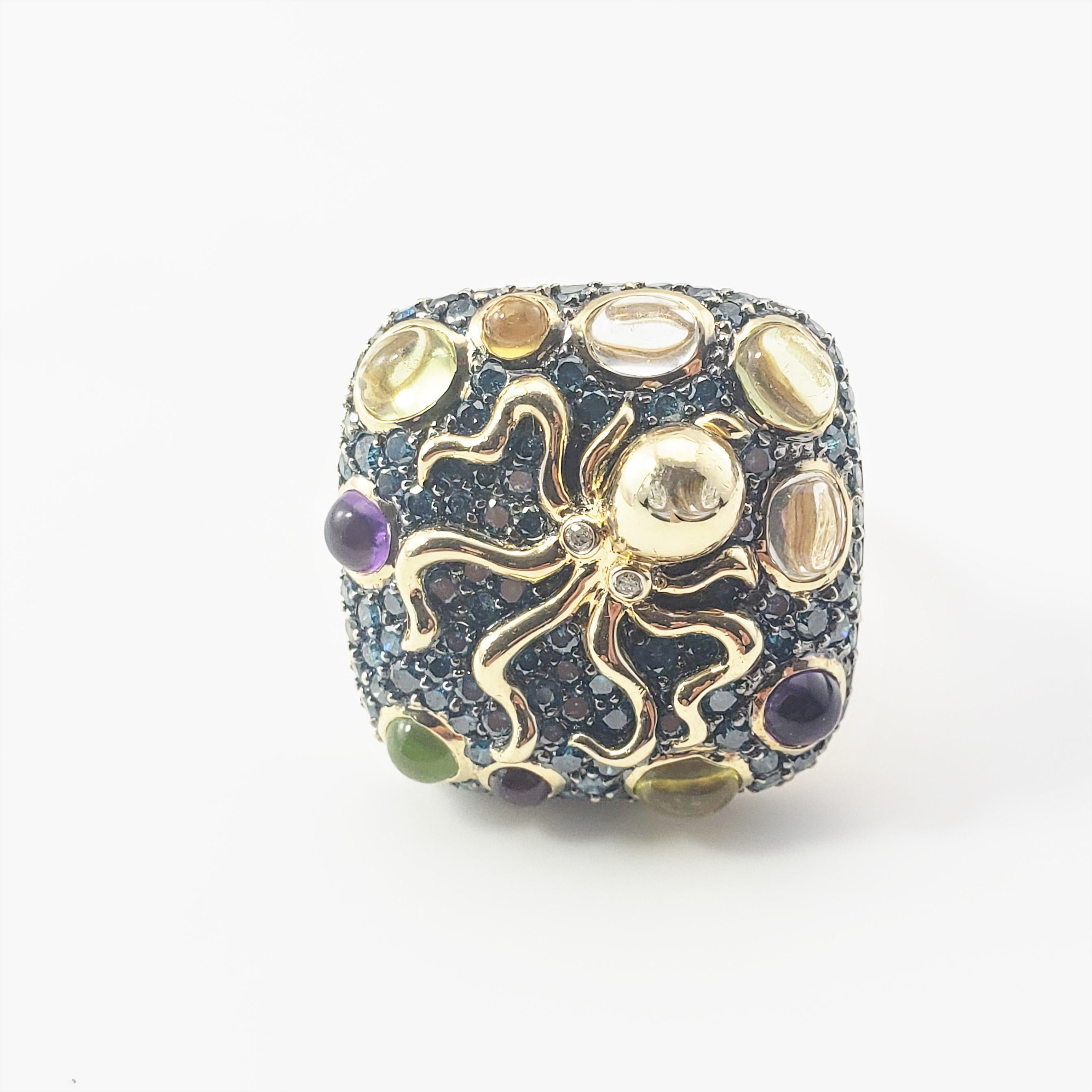 14 Karat Yellow Gold Diamond, Peridot, Amethyst and Garnet Octopus Ring Size 7.5 GAI Certified-

This octopus ring features 116 blue diamonds, two white diamonds and cabochon peridot, amethyst and garnet gemstones set in beautifully detailed 14K