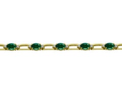 14 Karat Yellow Gold Diamond and Emerald Tennis Bracelet