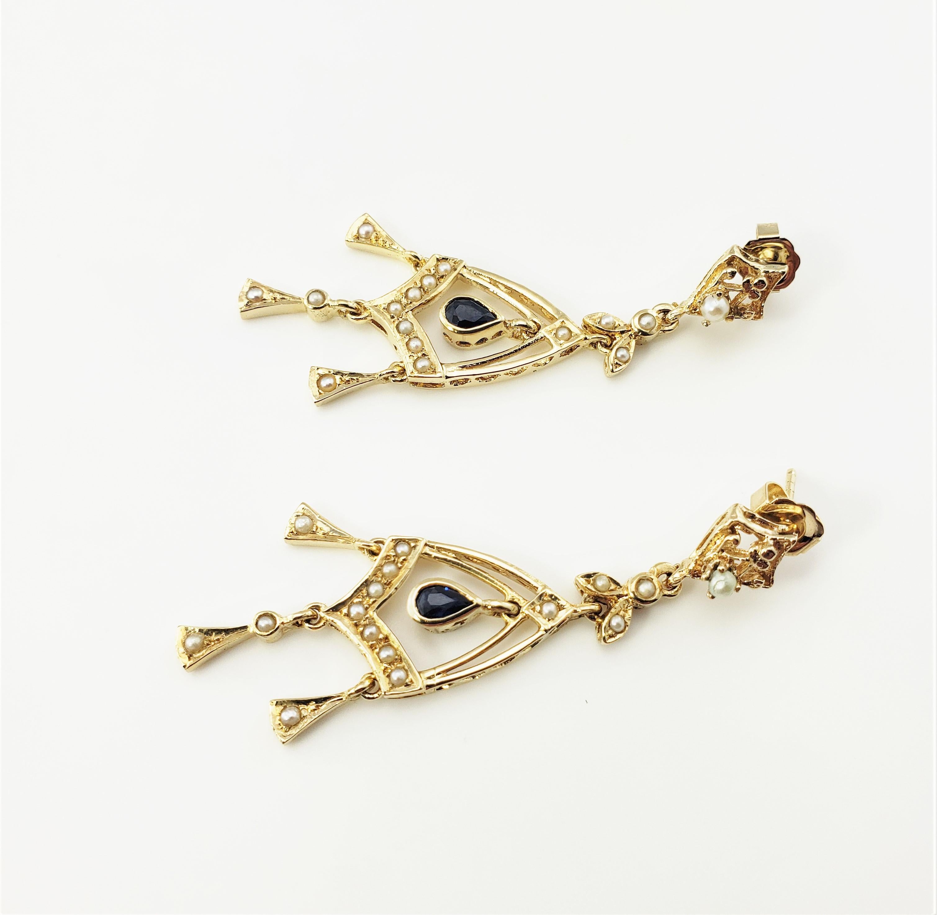 14 Karat Yellow Gold Diamond and natural Sapphire Dangle Chandelier Earrings-

These elegant chandelier earrings each feature one pear shaped sapphire (5 mm x 4 mm) and 16 seed pearls set in classic 14K yellow gold.  Push back closures.

Size:  1.9