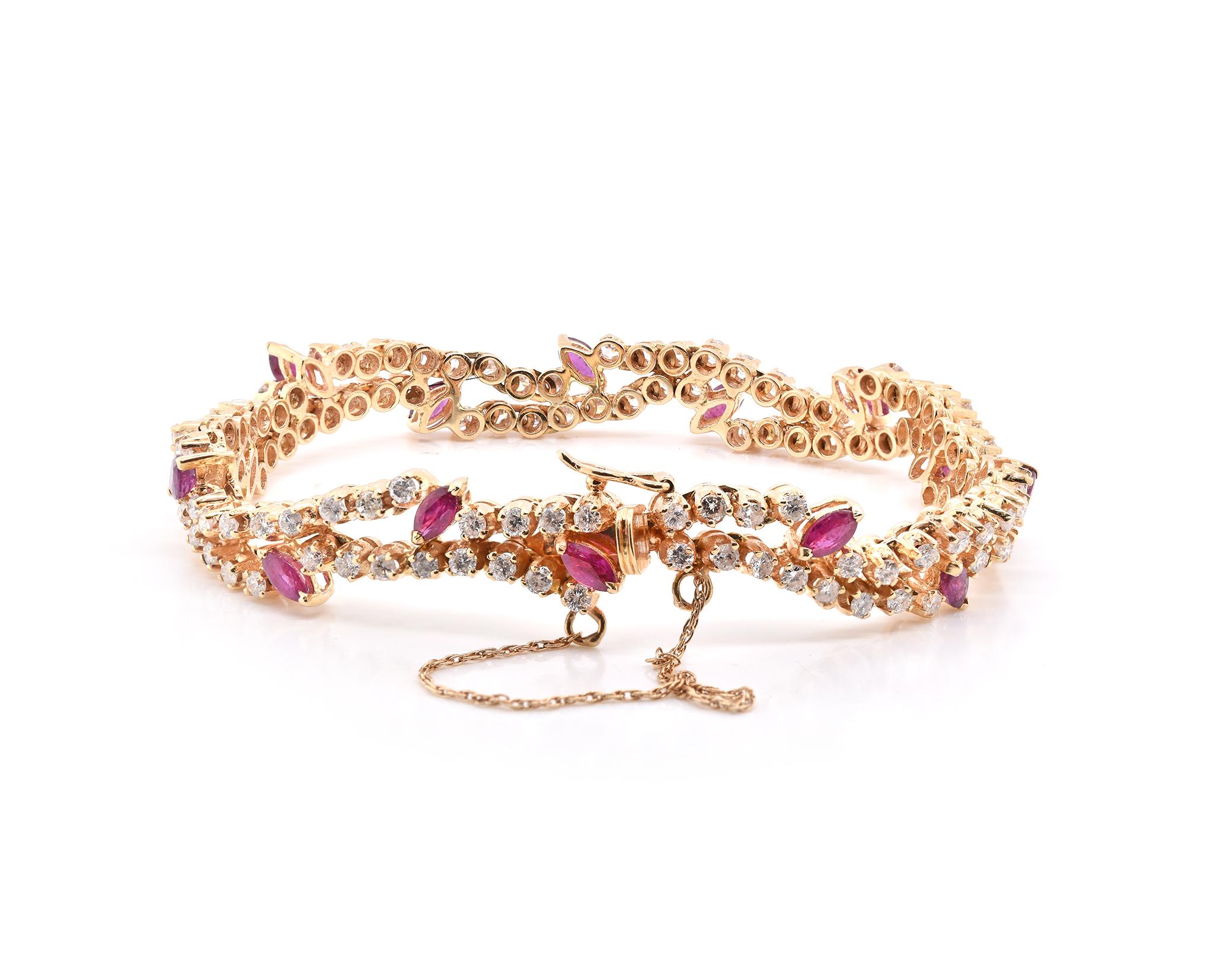 Designer: custom
Material: 14K yellow gold
Ruby: 14 marquise cut = 1.12cttw
Diamond: 110 round cut = 2.75cttw
Color: G
Clarity: SI1
Dimensions: bracelet measures 7.5-inches
Weight: 20.74 grams