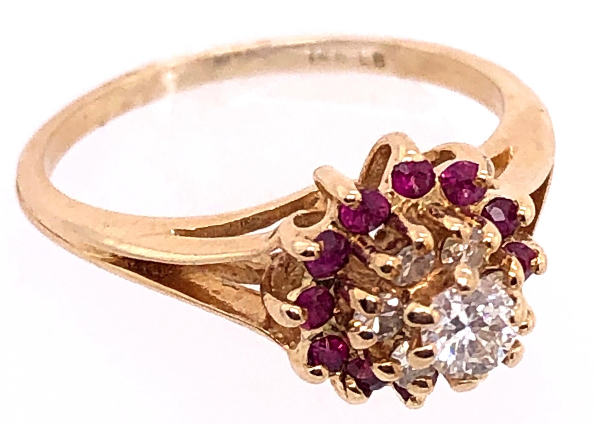 Round Cut 14 Karat Yellow Gold Diamond and Ruby Cluster Contemporary Ring 0.20 TDW For Sale