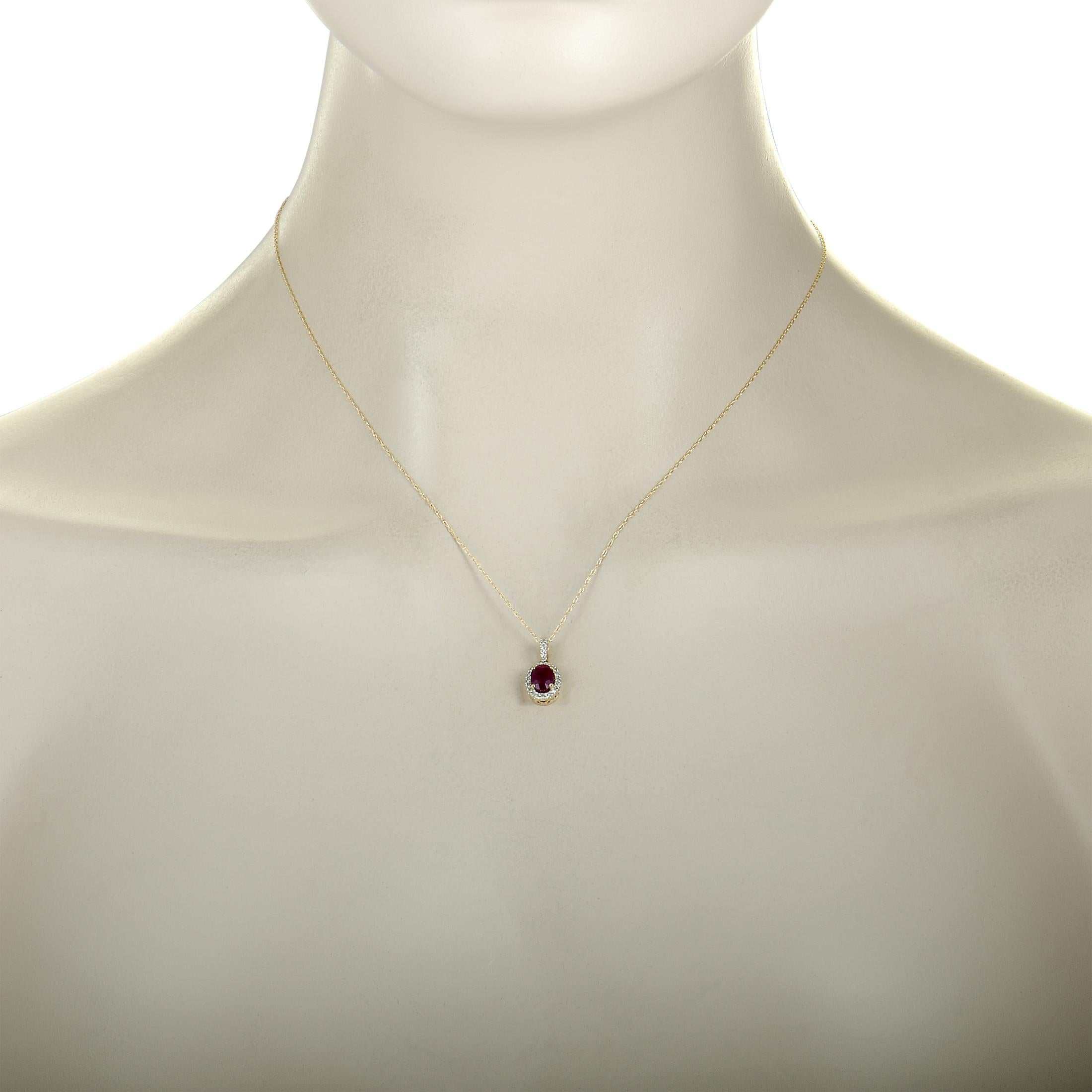 This necklace is made of 14K yellow gold and set with a ruby and a total of 0.12 carats of diamonds. It has an 18.00” long chain with spring ring closure, while the pendant measures 0.62” in length and 0.30” in width. The necklace weighs 1.7 grams.

