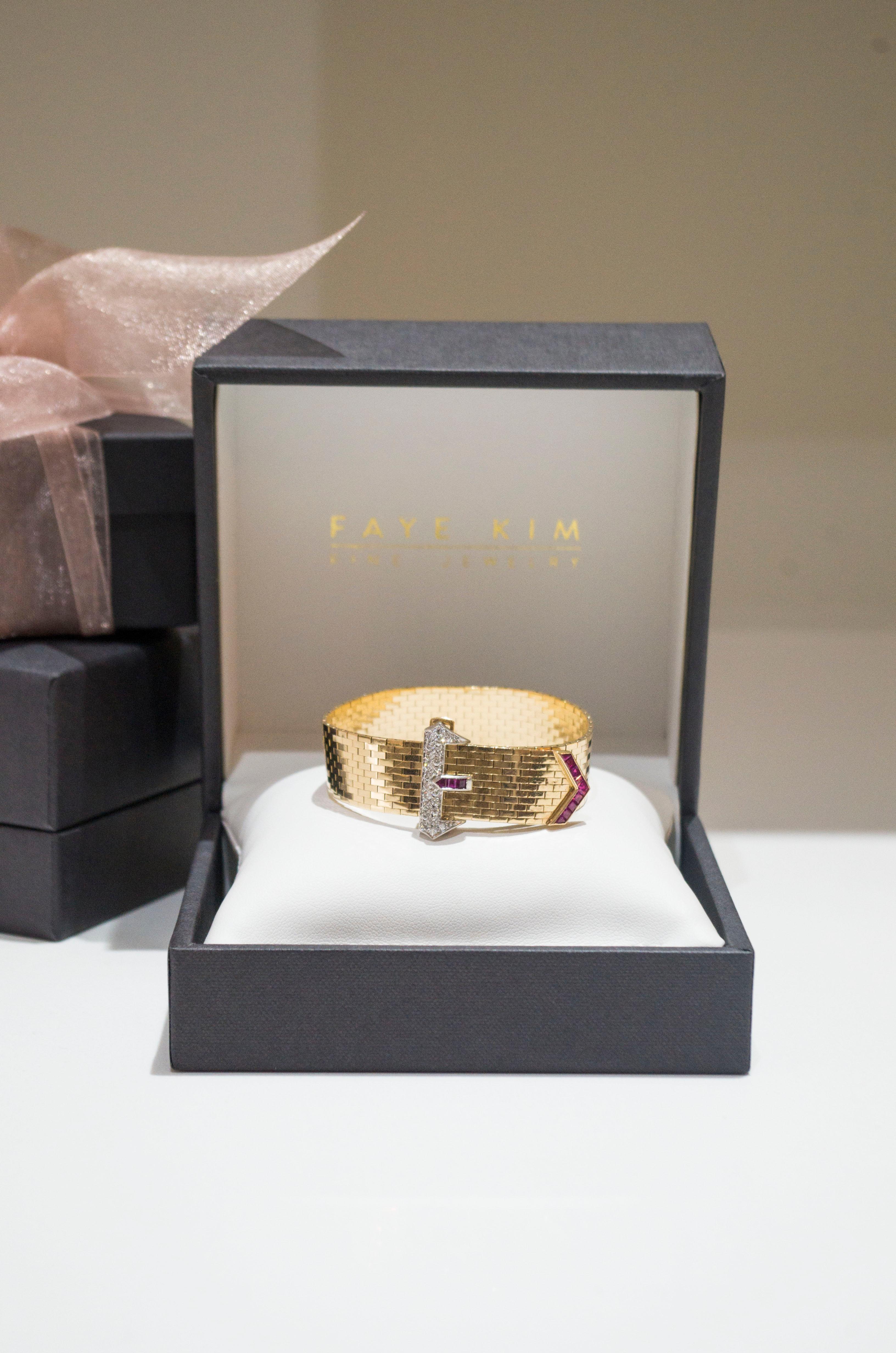 14k Yellow Gold Diamond and Ruby Flexible Brick Mesh Strap Buckle Bracelet in the Art Deco Style
 
The quality of the craftsmanship is evident in its flexible brick mesh that is elegantly embellished with diamonds set in platinum and rubies in