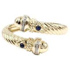 14 Karat Yellow Gold Diamond and Sapphire Bypass Cable Cuff Bracelet