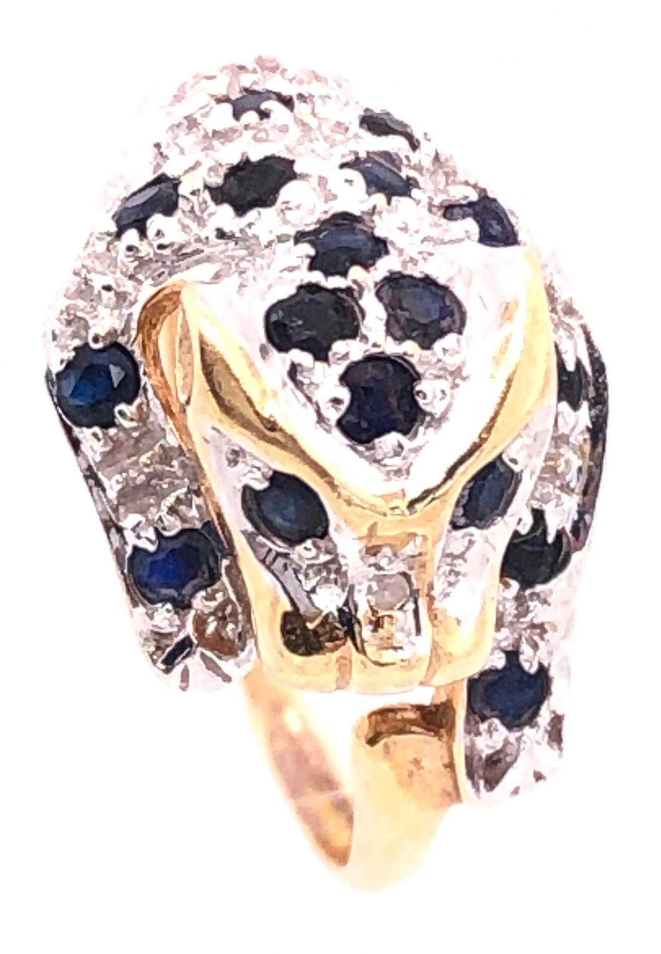 14 Karat Yellow Gold Diamond and Sapphire Panther Ring
0.01 total diamond weight
17 round sapphires
Size 6.5
2 grams total weight.
