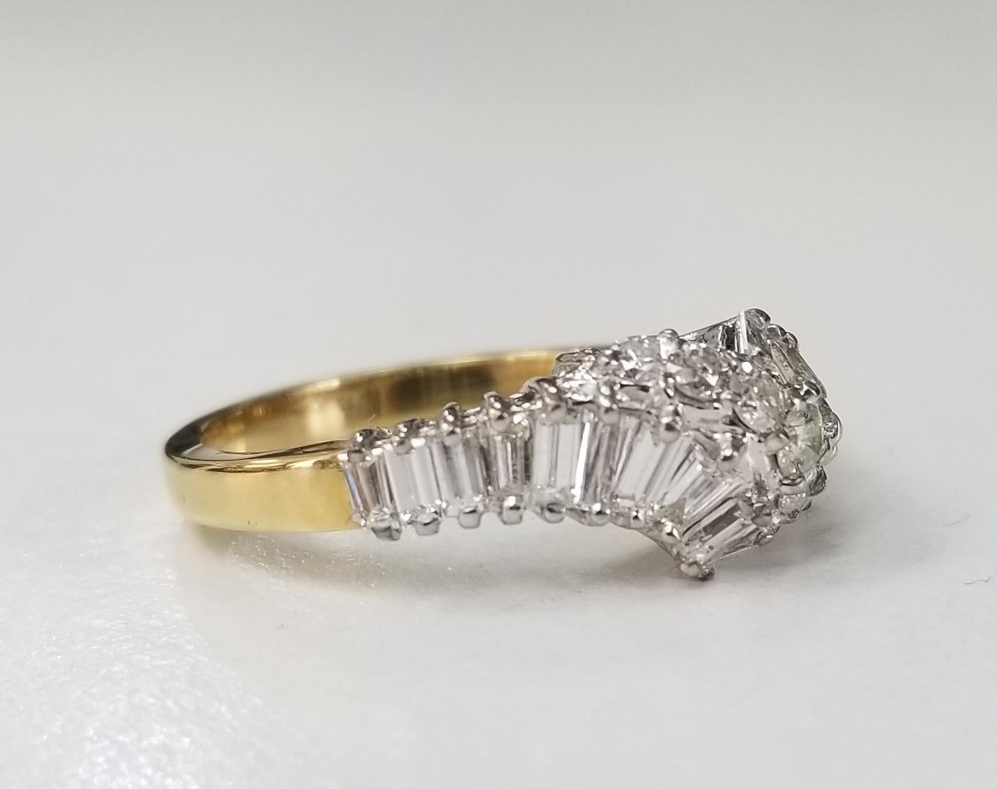 14 karat yellow gold diamond baguette and round set ring, containing 20 baguette cut diamonds weighing 1.00ct.s
7 round full cut diamonds  weighing .30pts.  This ring is a size 6.5 but we will size to fit for free.