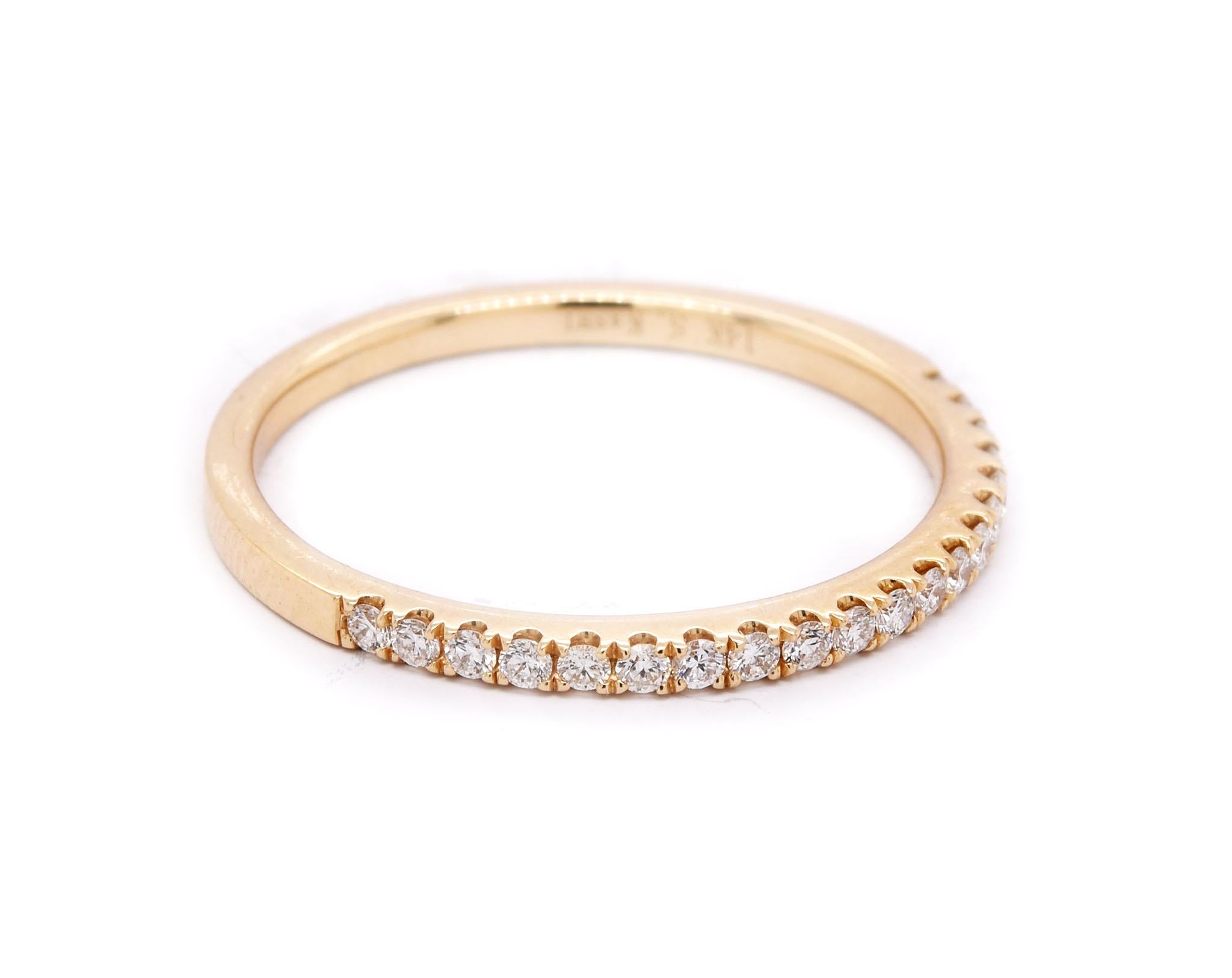 Designer: custom 
Material: 14K yellow gold
Diamonds: 20 round brilliant cut = .20cttw
Color: G
Clarity: VS1
Ring Size: 6.5
Dimensions: ring is 1.5mm wide
Weight: 1.51 grams
