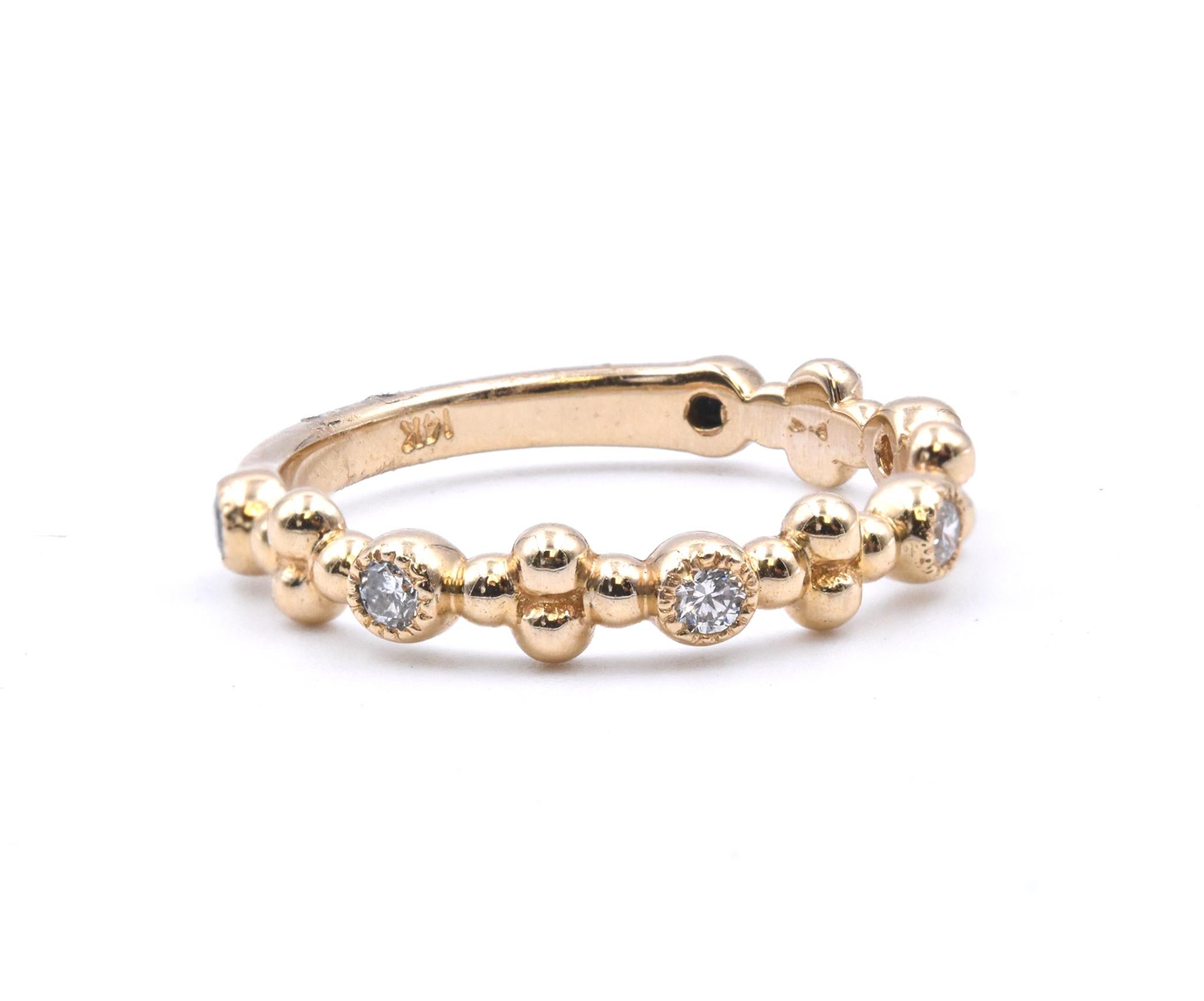 Designer: custom
Material: 14k yellow gold
Diamonds: 6 round cut = .20cttw
Color: G
Clarity: VS
Size: 6.5 (please allow two additional shipping days for sizing requests)  
Dimensions: ring measures 2.7mm in width
Weight: 2.46 grams