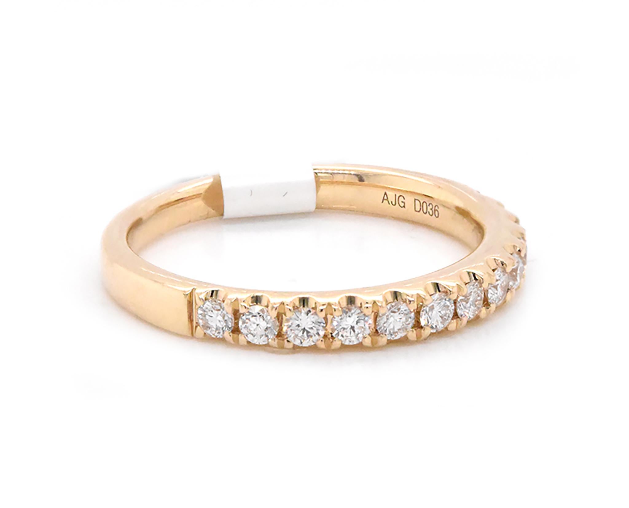 Designer: custom
Material: 14k yellow gold
Diamonds: 13 round cut = .36cttw
Color: G
Clarity: VS
Size: 7 (please allow two additional shipping days for sizing requests)  
Dimensions: ring measures 3mm in width
Weight: 2.91 grams
