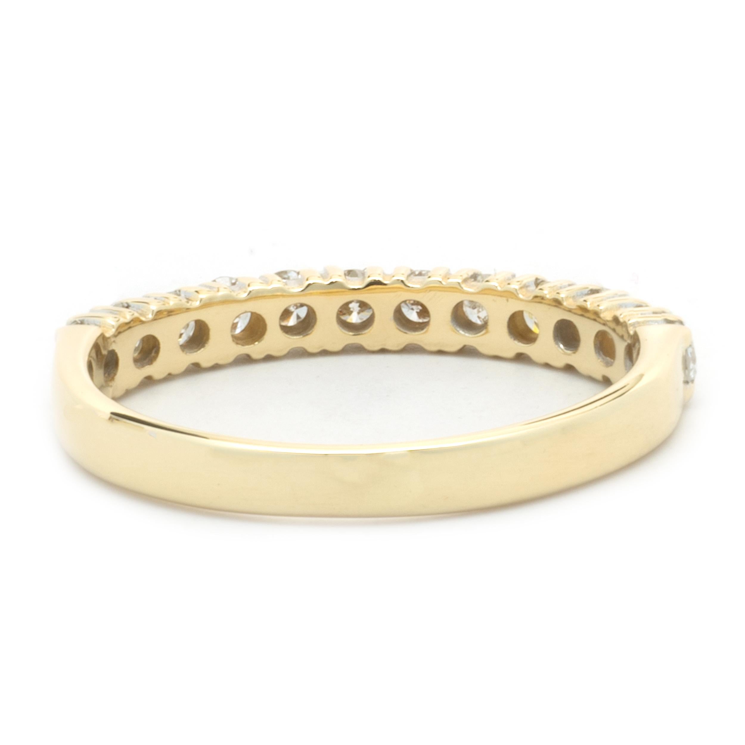 Designer: Custom
Material: 14k yellow gold 
Diamonds: 12 round brilliant cut = .36cttw 
Color: G
Clarity: SI1
Size: 6
Dimensions: ring measures 2.75mm in width
Weight: 1.96 grams
