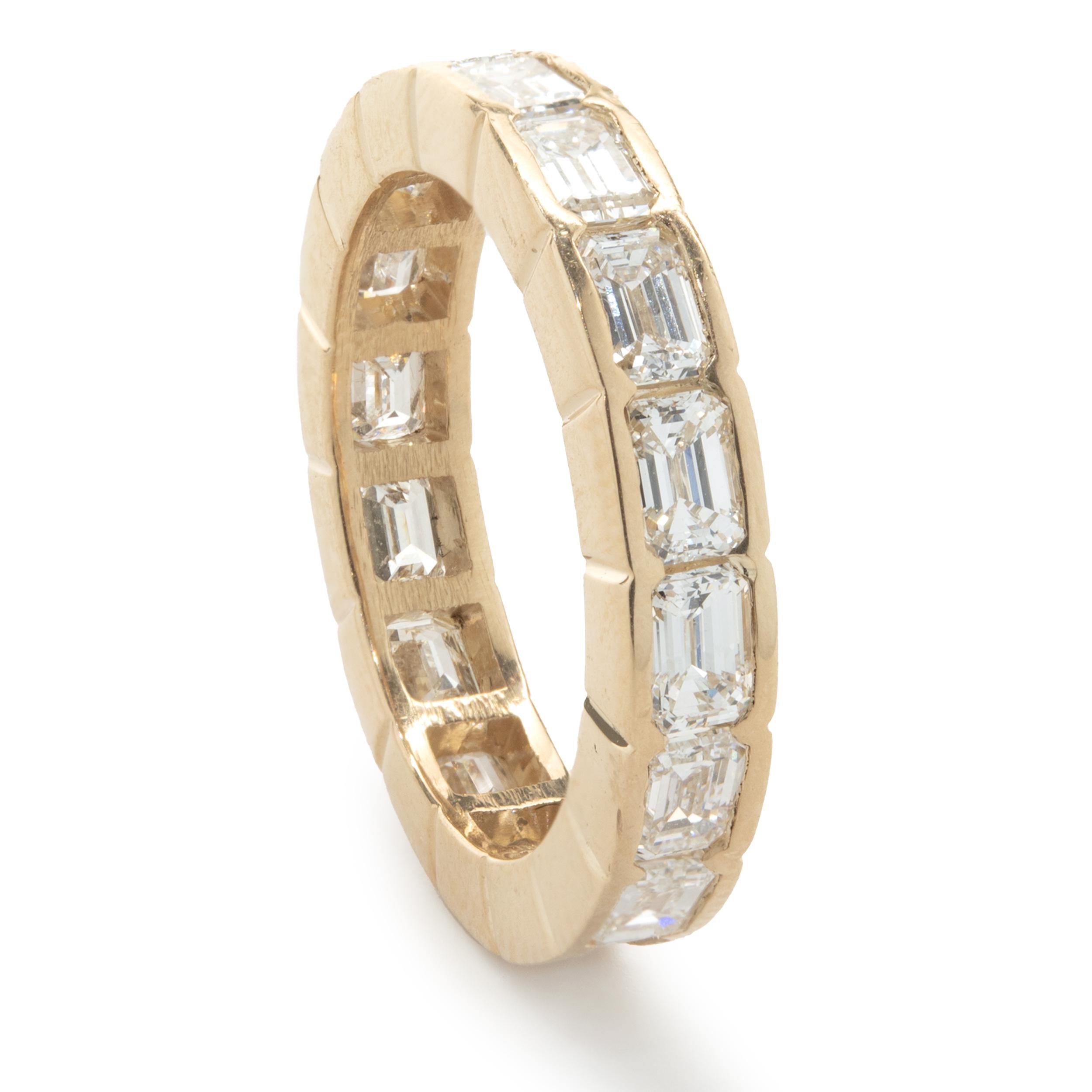 Designer: Custom
Material: 14K yellow gold
Diamonds: 17 emerald cut = 3.25cttw
Color: G
Clarity: VS1
Size: 5.5 (complimentary sizing available)
Dimensions: ring measures 4.90mm in width
Weight: 3.42 grams
