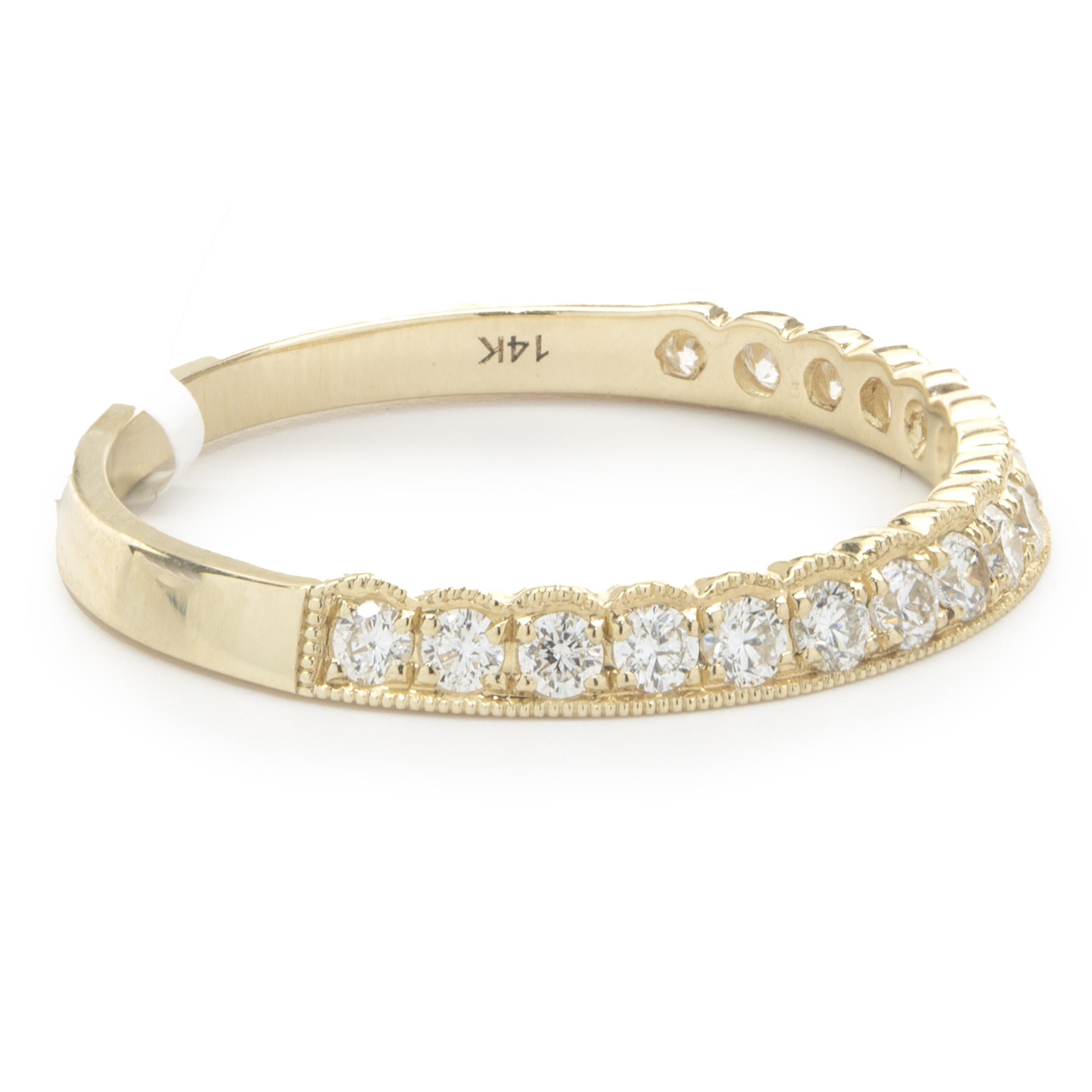 Designer: Custom
Material: 14K yellow gold
Diamond: 17 round brilliant cut = 0.38cttw
Color: G
Clarity: SI1
Size: 6.5 (complimentary sizing available upon request)
Weight: 1.51 grams